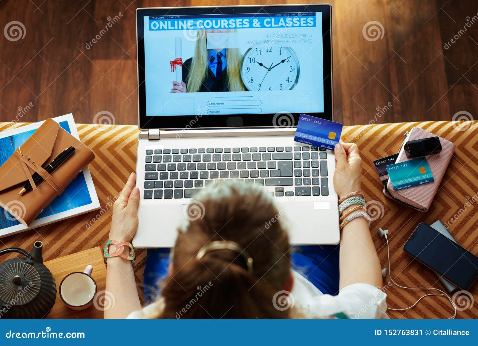 woman with credit card subscribing to computer courses website