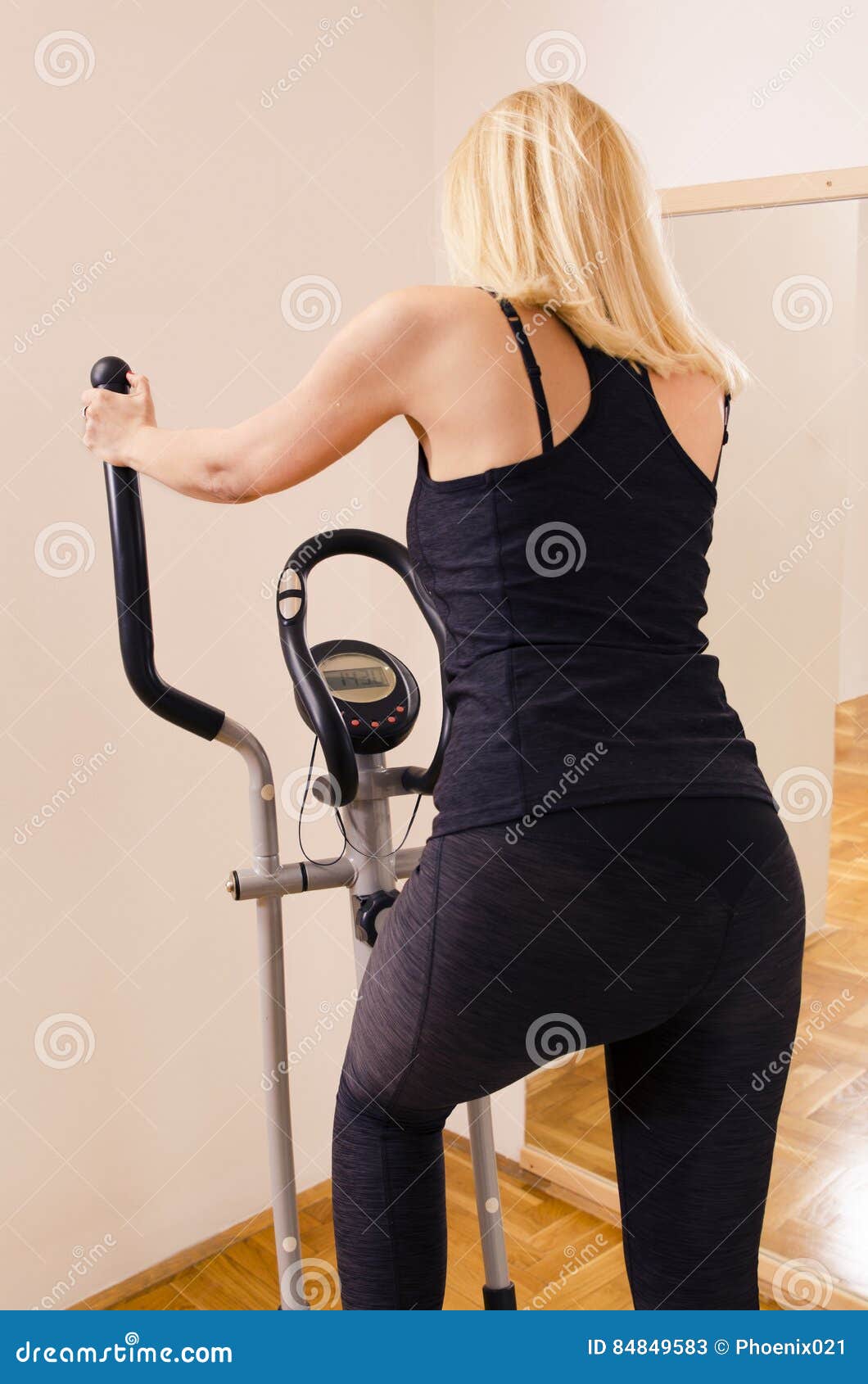 Fit Blonde Elliptical Trainer Stock Photos - Free & Royalty-Free