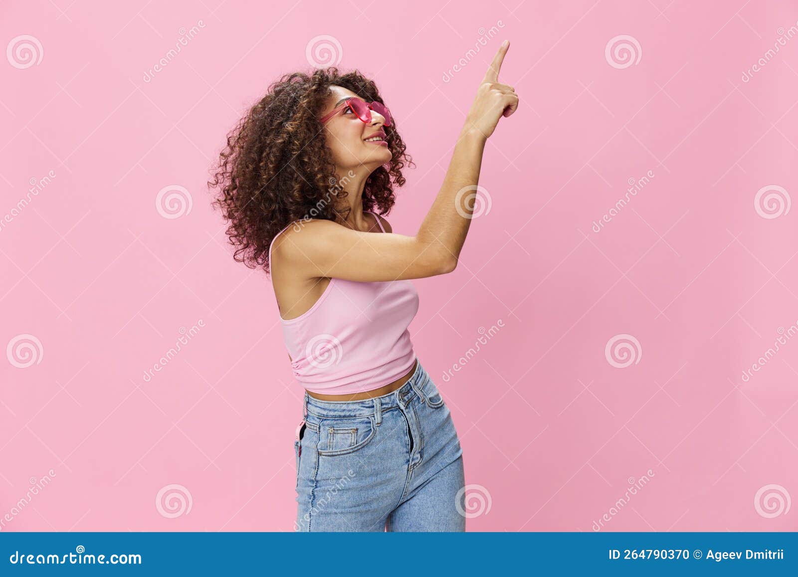 Premium PSD | A embarrassed child girl with long hair from the african  ethnicity dressed in brewer attire poses in a sitting with legs stretched  out style against a pastel coral background