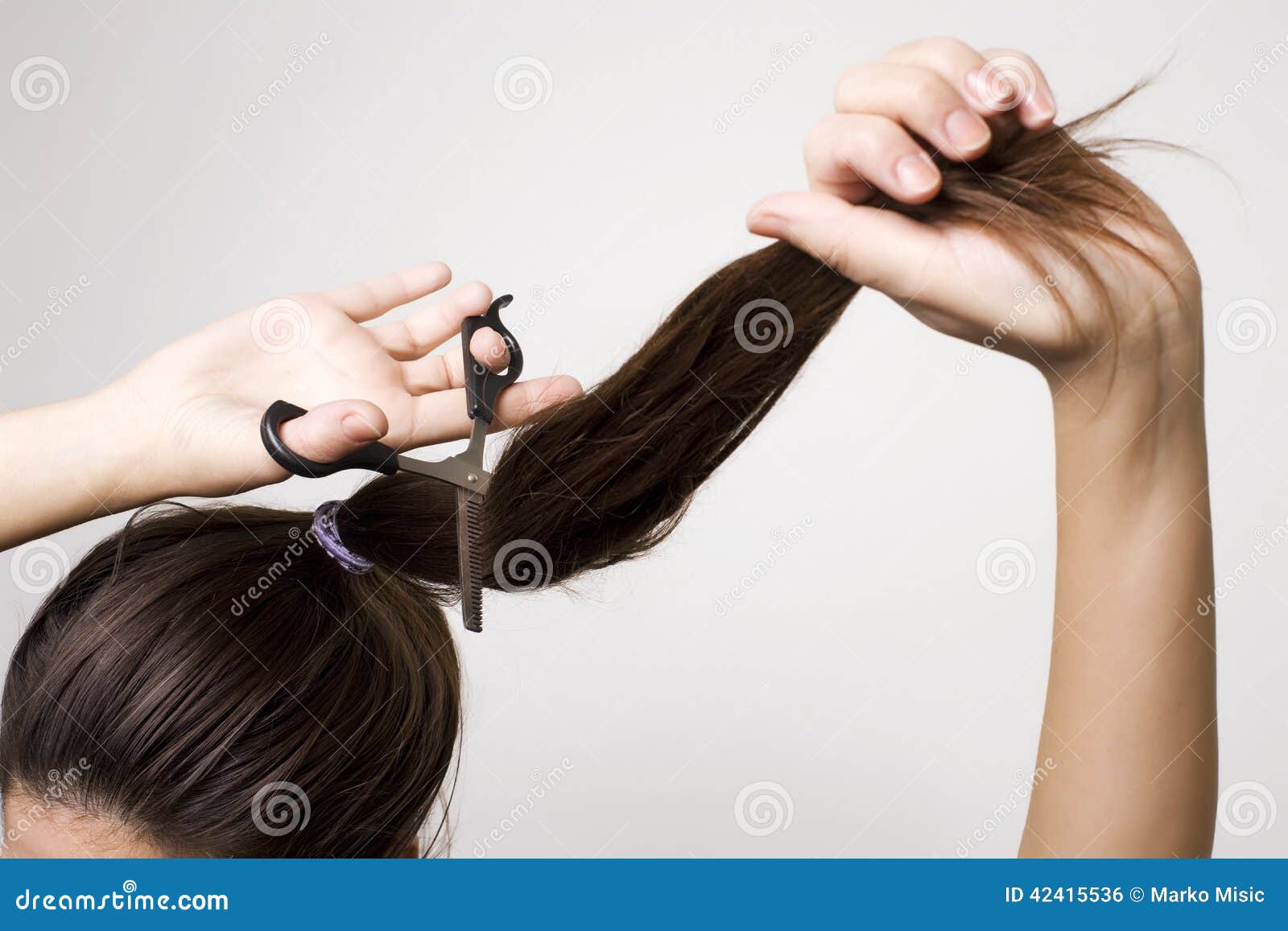 Woman cutting her ponytail stock photo. Image of ends 