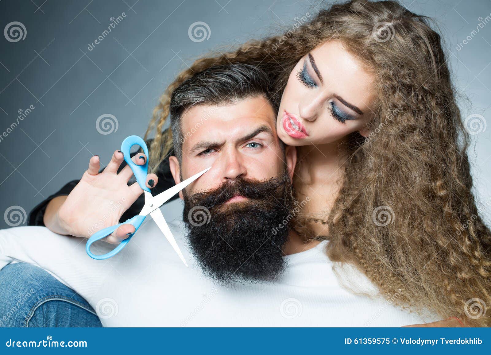 Woman Cutting Man's Beard Stock Photo - Image: 61359575