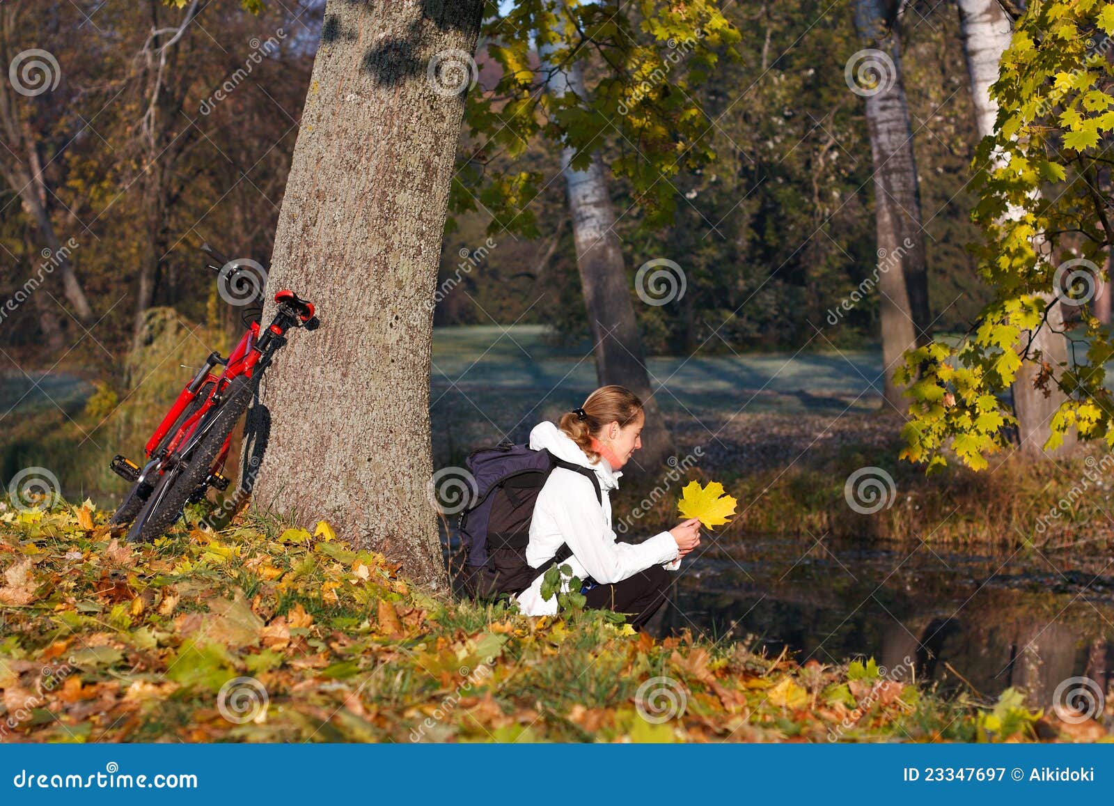 Woman Cyclist Relaxing in Autumn Park Stock Image Image of orange