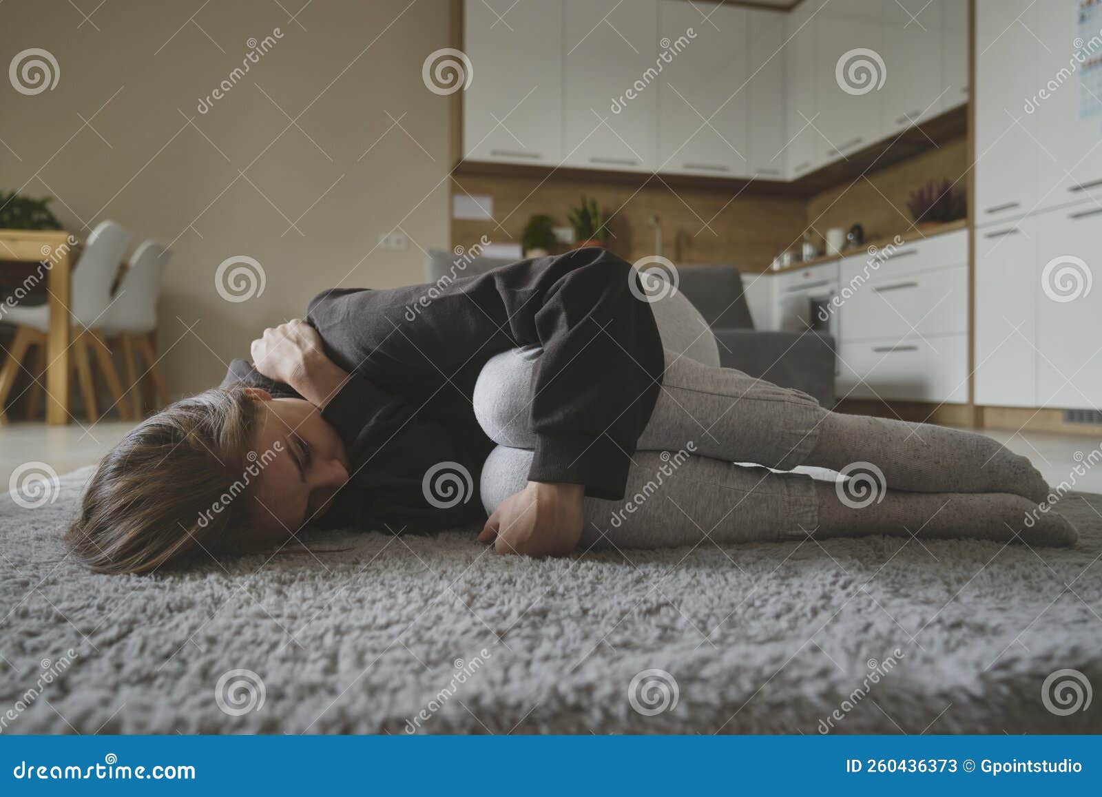 Woman with Depression Lying Down at the Carpet Stock Image Image of