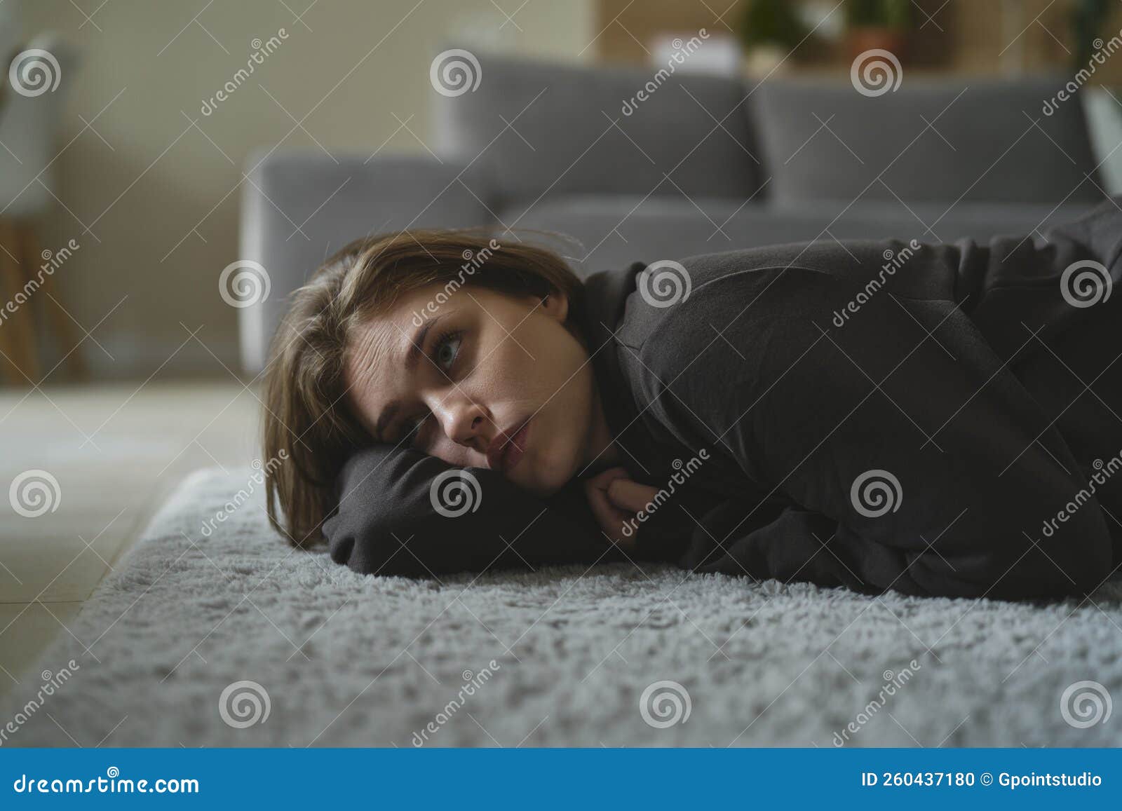 Woman with Depression Lying Down at the Carpet Stock Photo Image of