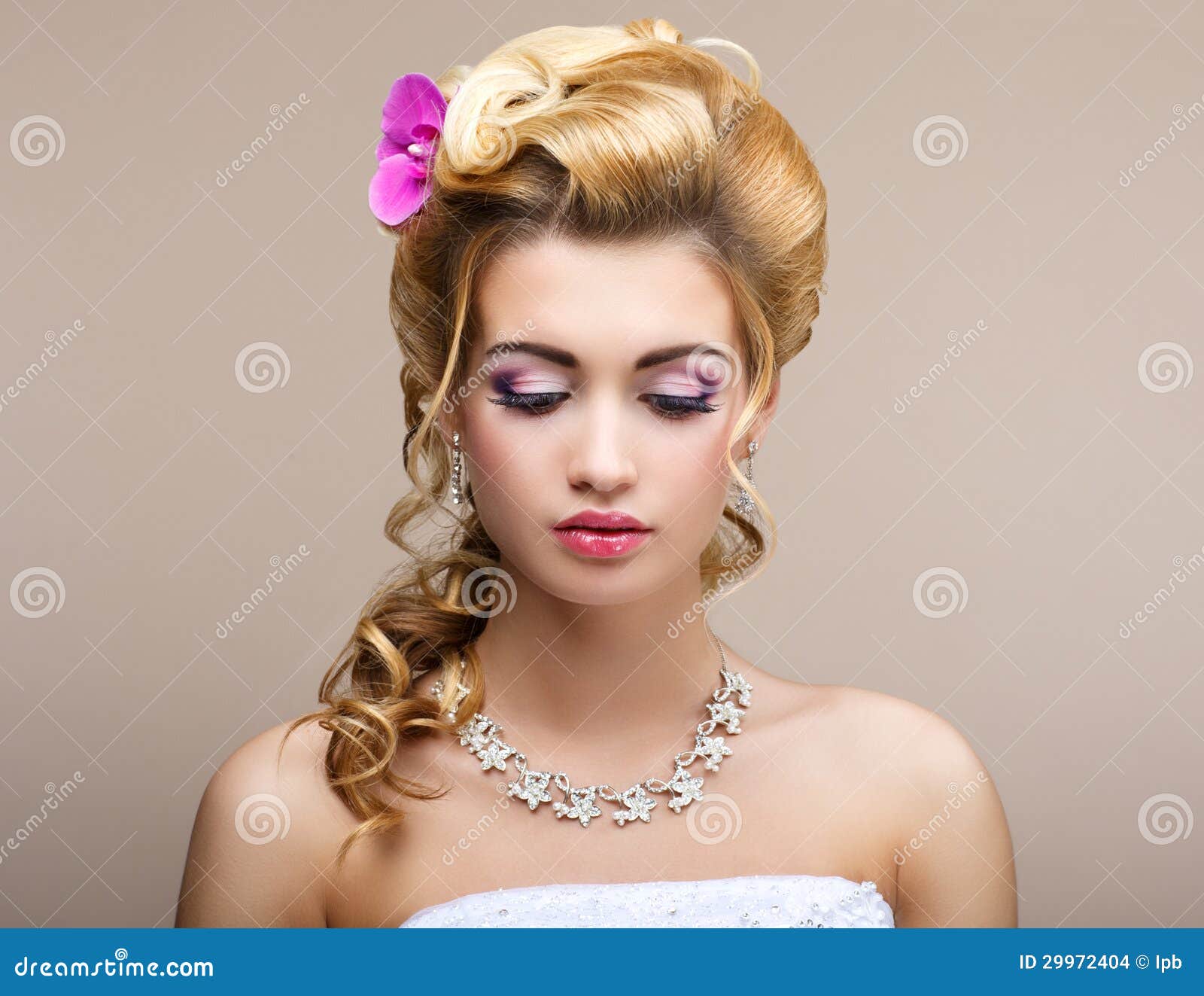 wedding. beautiful thinking bride with diamond necklace. elegance & femininity