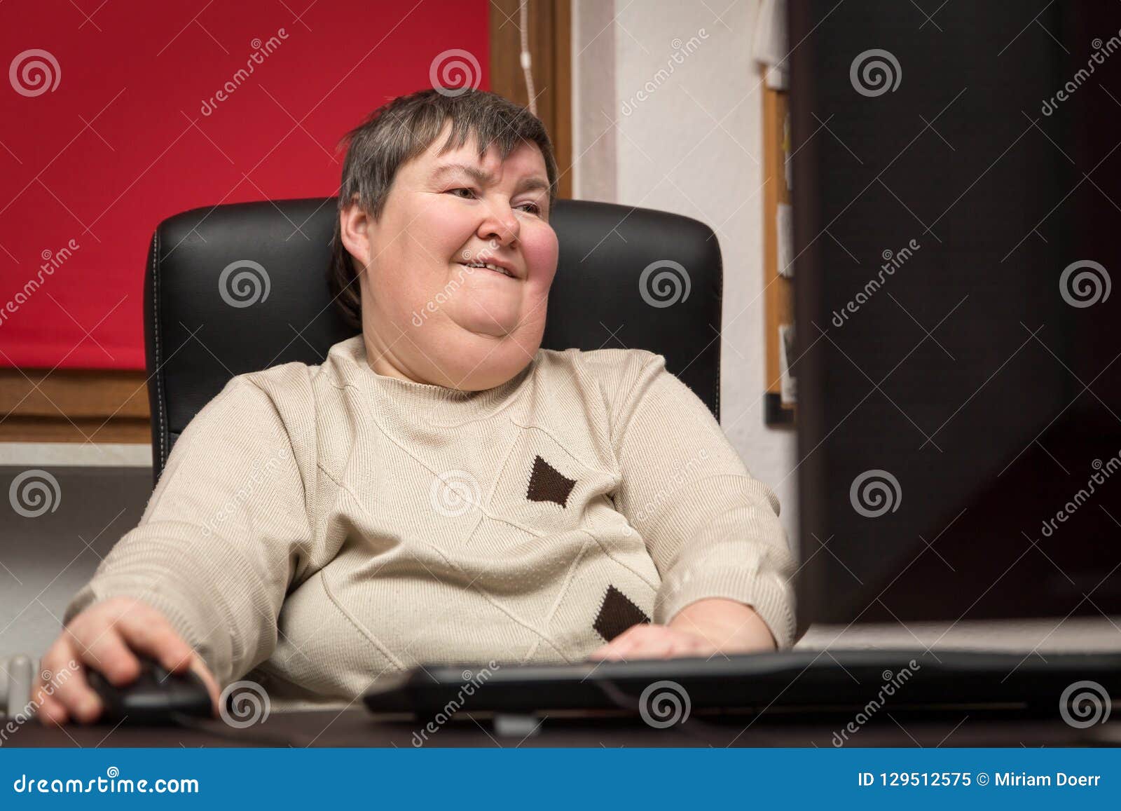 woman with a disability develop sitting at the computer, alternative therapy
