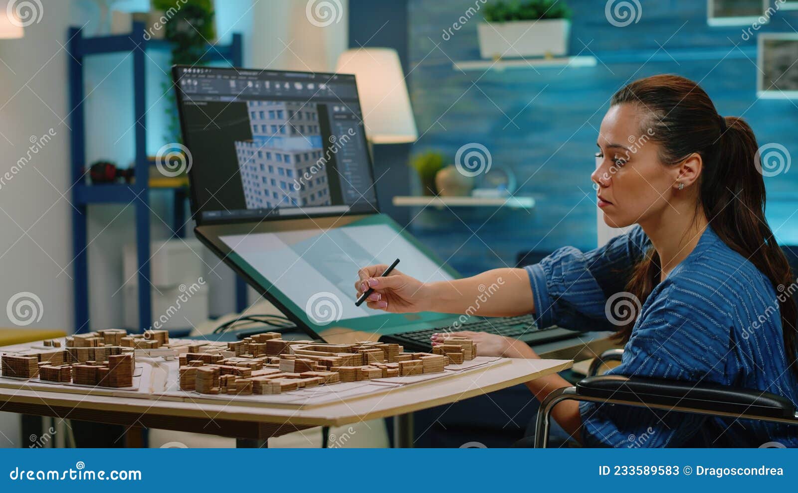 Woman with Disability Using Touch Screen for Construction Layout Stock