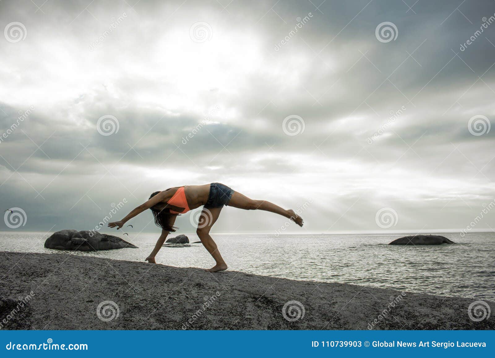 Woman Doing A Handstand On A Rock At Sunset On Bakovern Beach Cape Town Stock Image Image Of