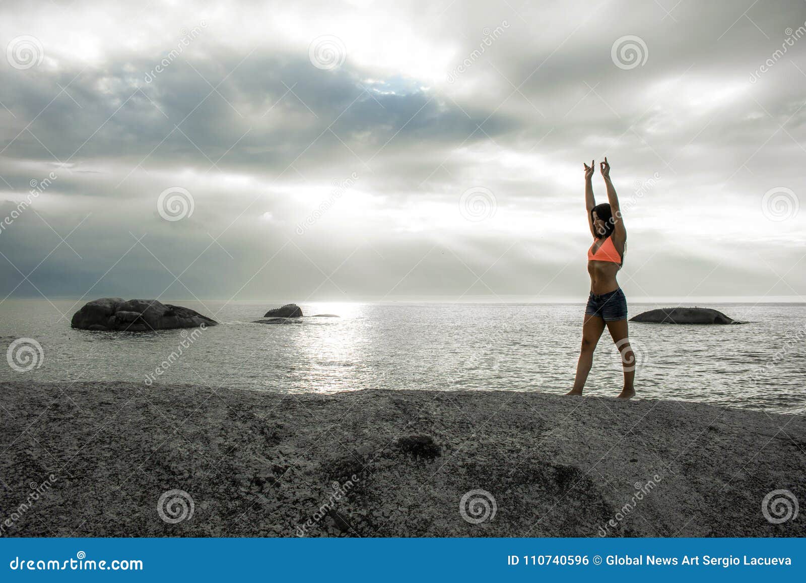 Woman Doing A Handstand On A Rock At Sunset On Bakovern Beach Cape Town Stock Photo Image Of
