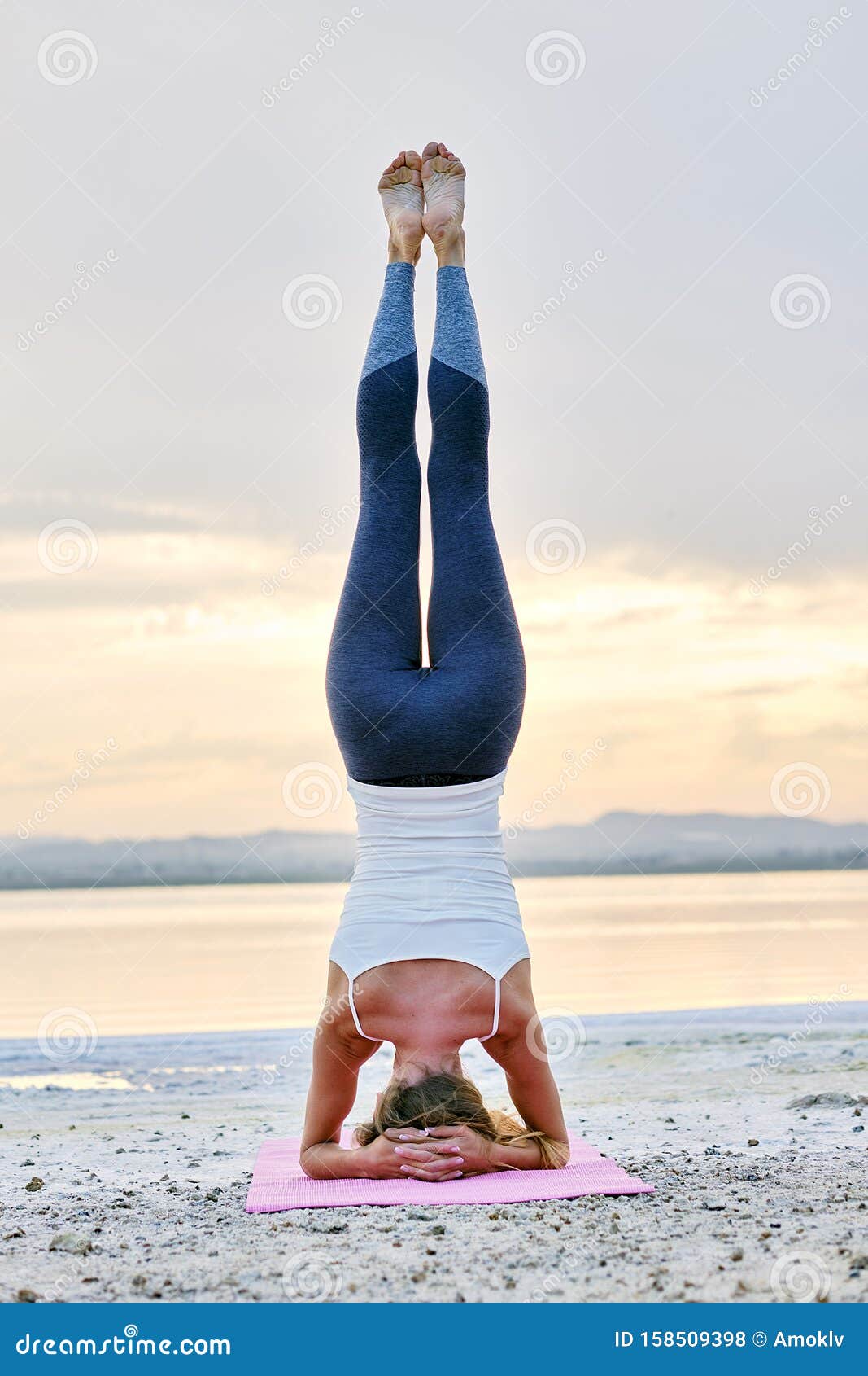 Girl Doing Yoga Pose,Shirshasana or Yoga Headstand is an Asana in