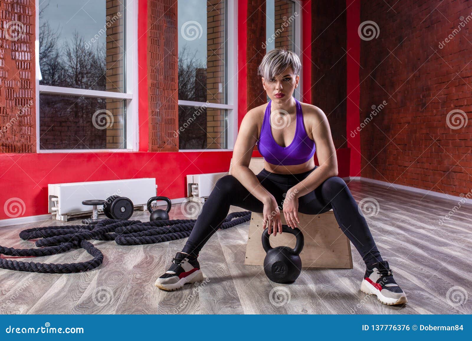 Woman Doing Kettle Bell Exercise in a Gym Stock Photo Image of
