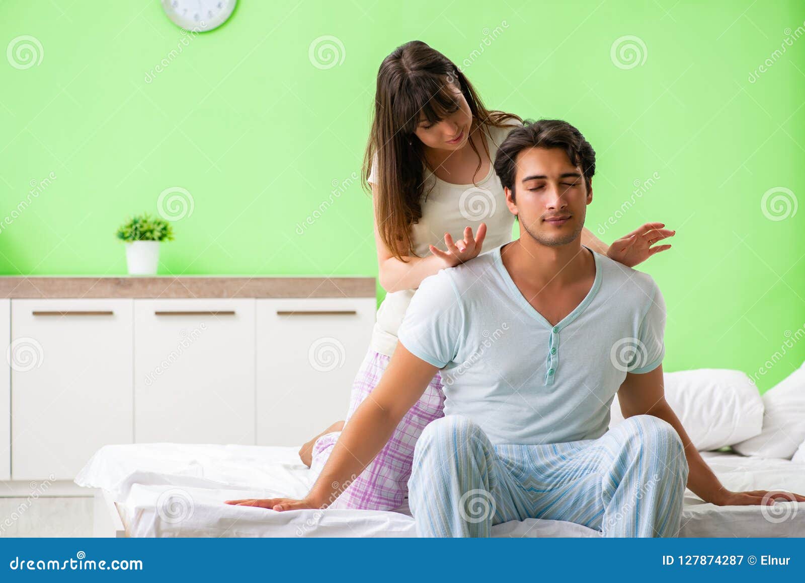 The Woman Doing Massage To Her Husband In Bedroom Stock Image Image