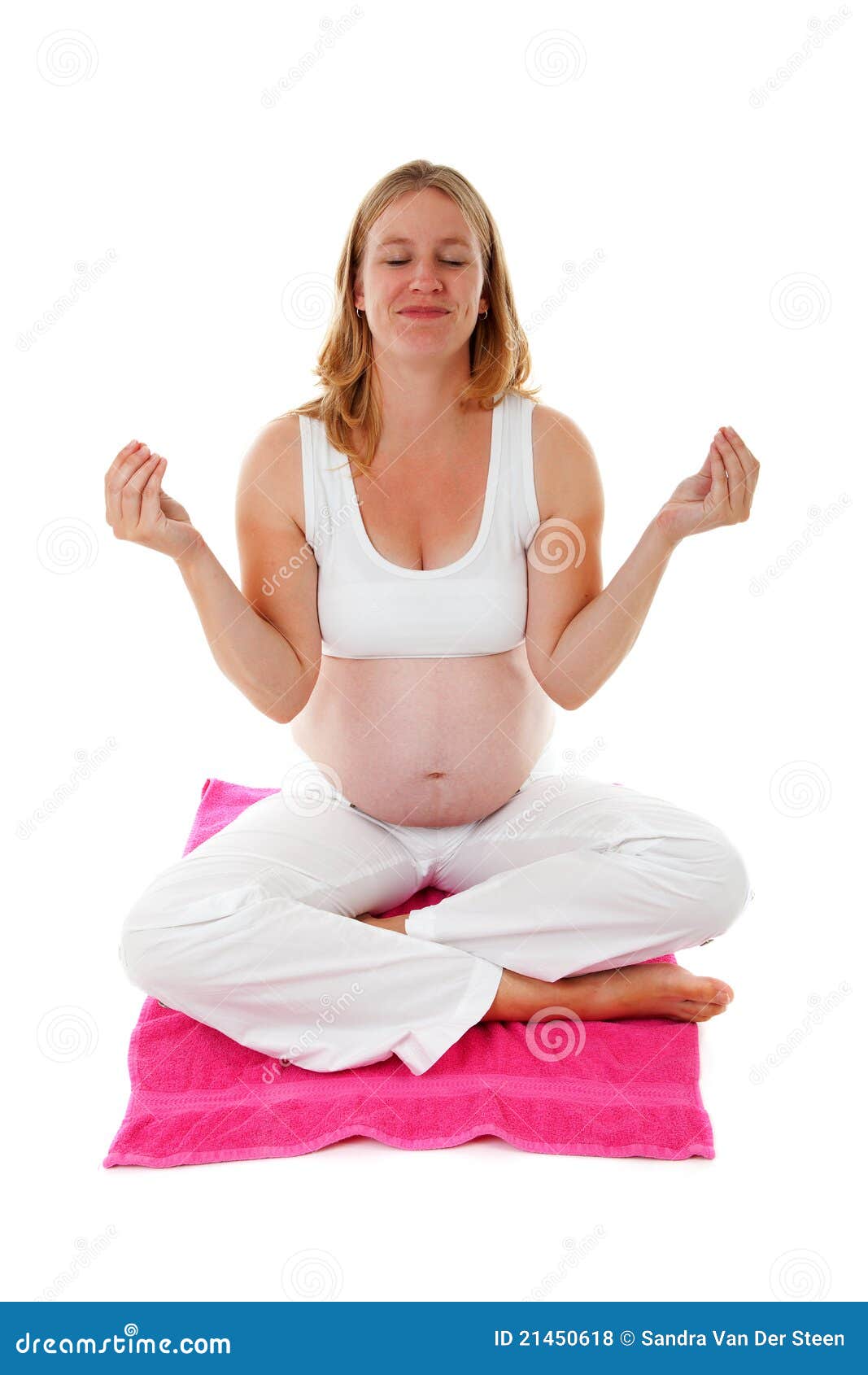 woman doing meditative pregnancy yoga