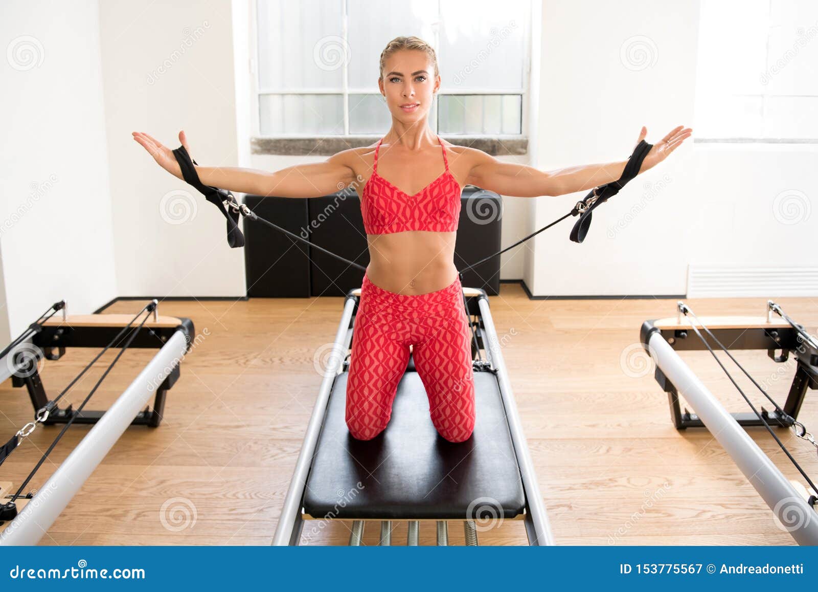 Woman Doing Pilates Arm Work with Straps Stock Image - Image of athlete,  fitness: 153775567