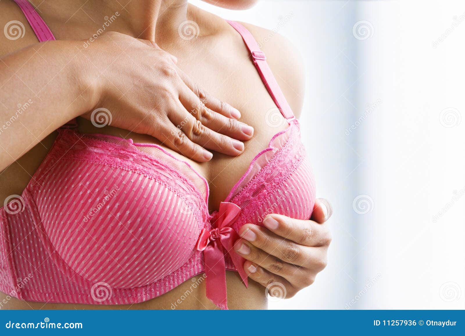 woman doing self breast examination