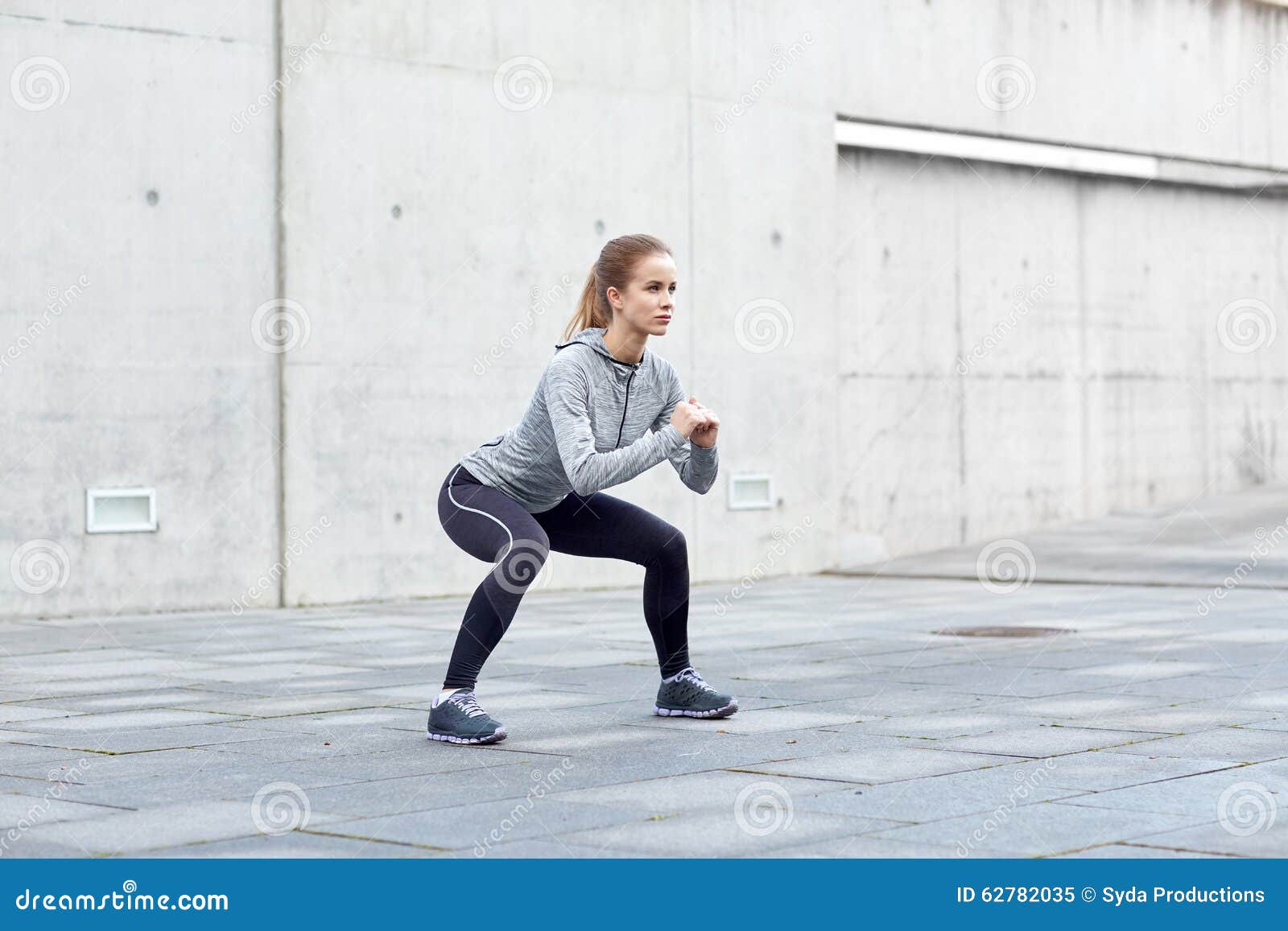 Woman Doing Squats and Exercising Outdoors Stock Image - Image of ...