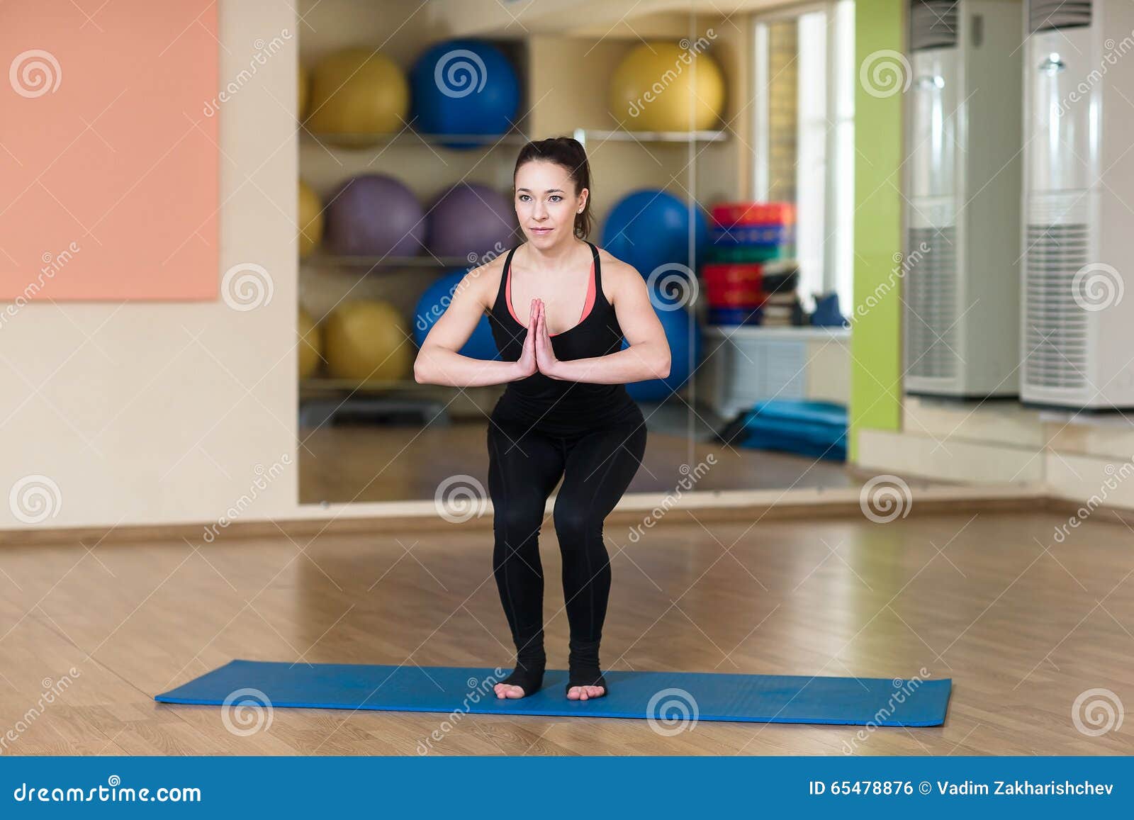 Woman Doing Squats and Holds Hands Namaste Stock Photo - Image of club ...