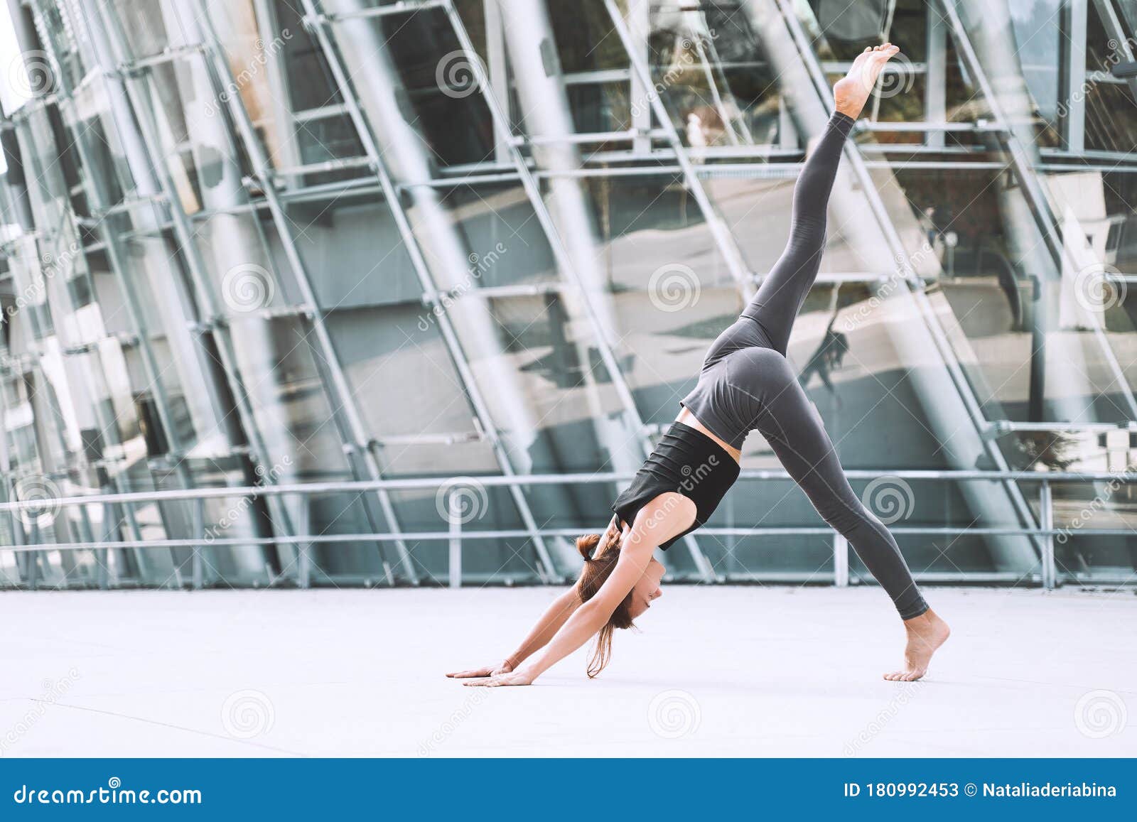 Woman Doing Stretching Yoga Exercises Outside in the City Stock Image ...