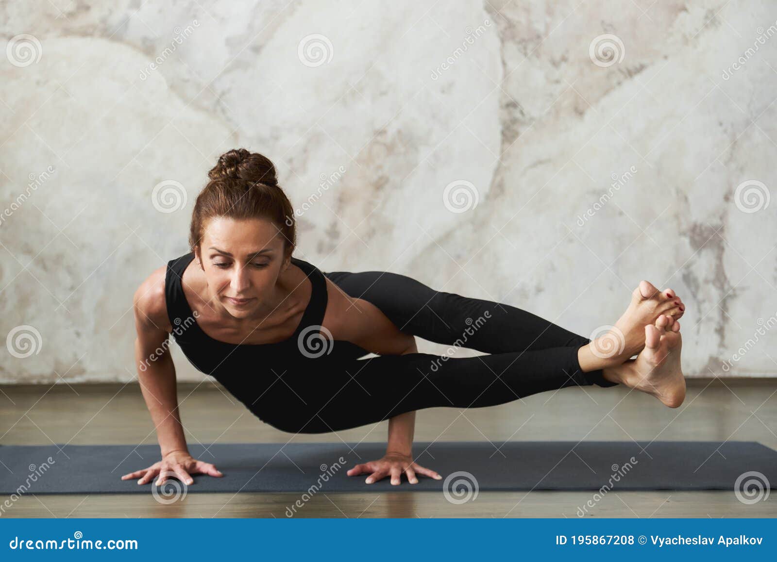 An Asian Chinese Female Yoga Instructor Demonstrating Yoga Poses Eightangle  Pose Astavakrasana High-Res Stock Photo - Getty Images