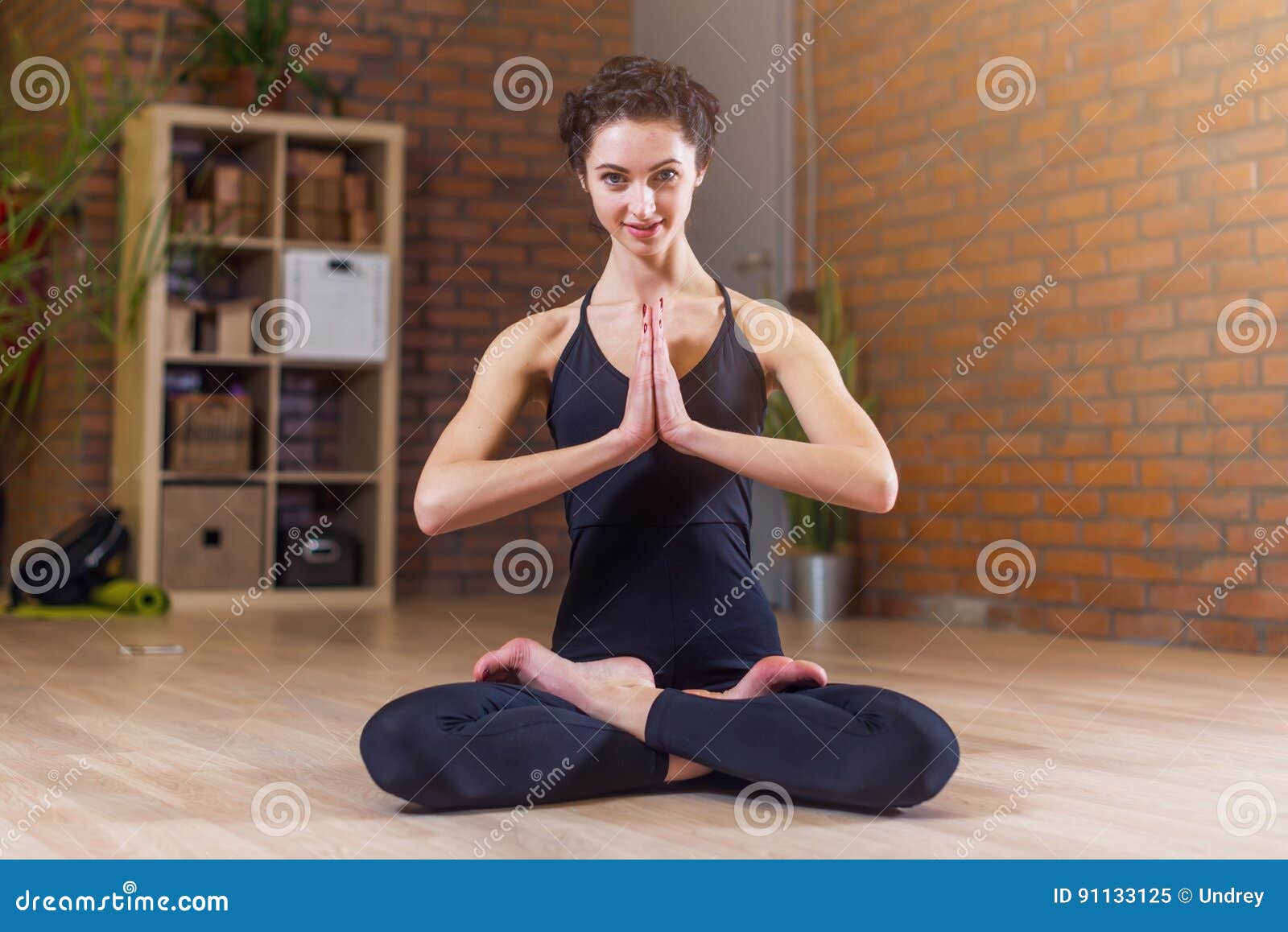 Full body of relaxed young African American Woman in sportswear meditating  in Lotus pose with closed eyes and prayer hands over head during online yog  Stock Photo - Alamy