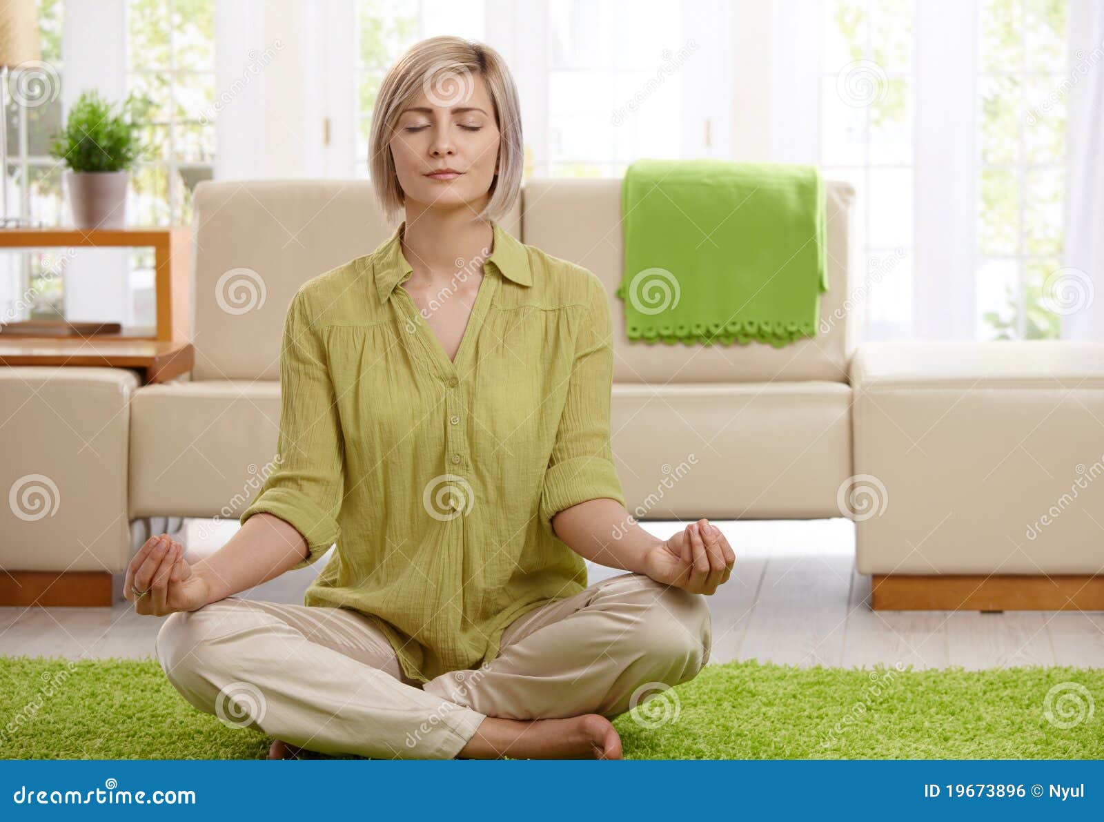 woman doing yoga meditation at home