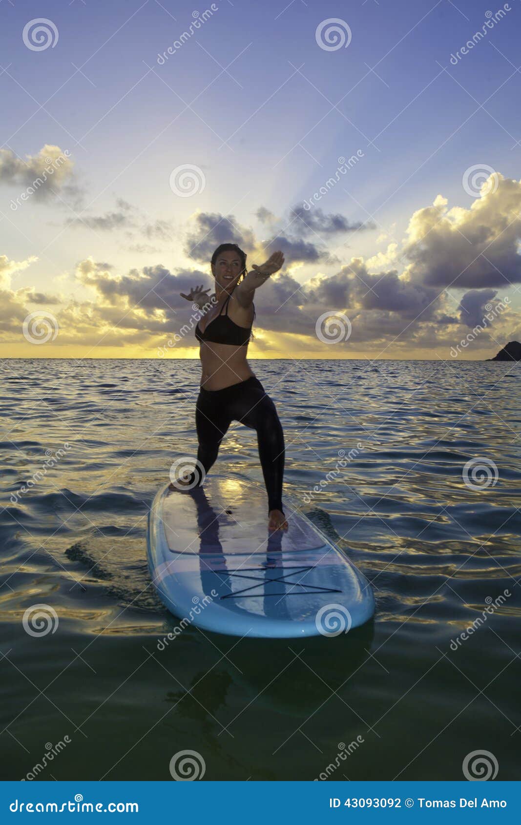 Woman Doing Yoga on a Paddle Board Stock Photo - Image of peaceful ...