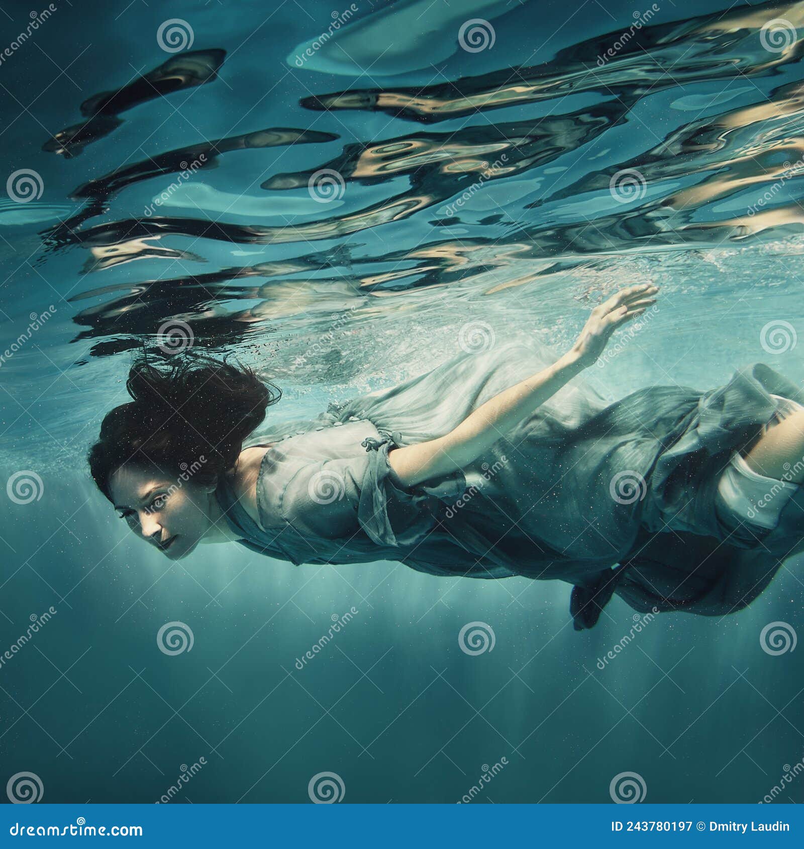 A Woman in a Dress Swims Underwater As If Floating in Zero Gravity ...