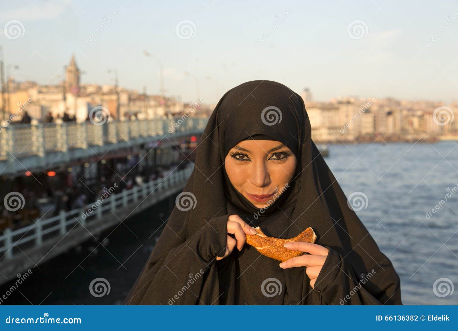 Woman Dressed With Black Headscarf Chador On Istanbul 