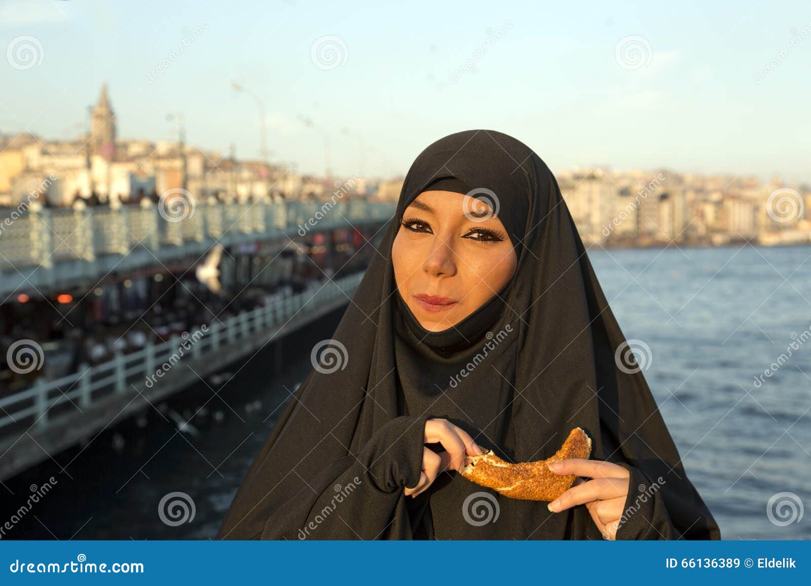 Woman Dressed With Black Headscarf, Chador On Istanbul 
