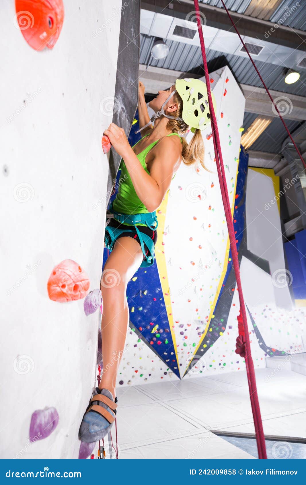 Sporty Young Woman Dressed In Rock Climbing Outfit Training At Bouldering  Gym Stock Photo, Picture and Royalty Free Image. Image 106758331.