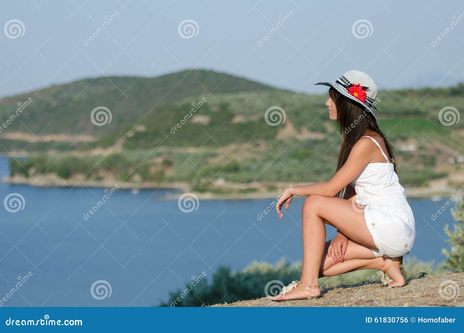 woman dressed with white coveralls rompers joying the sunny day