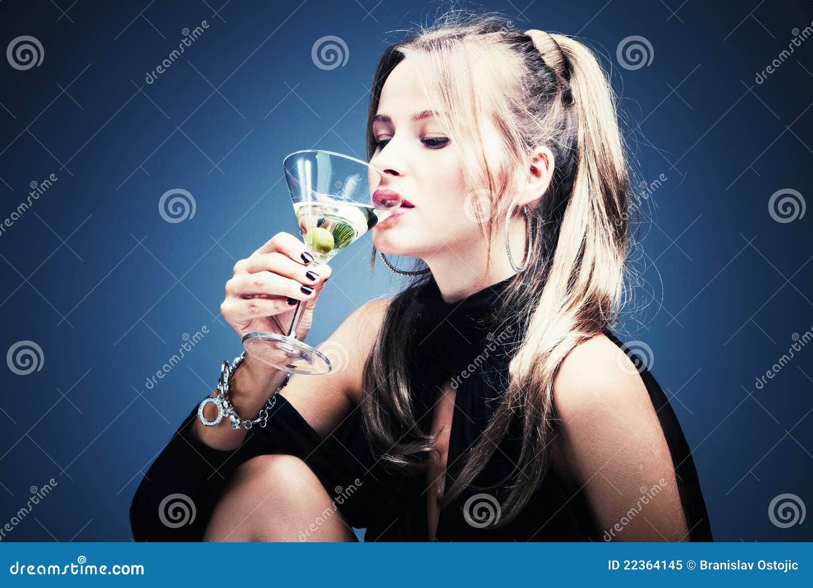 Woman drinking martini stock image. Image of vertical 22364145