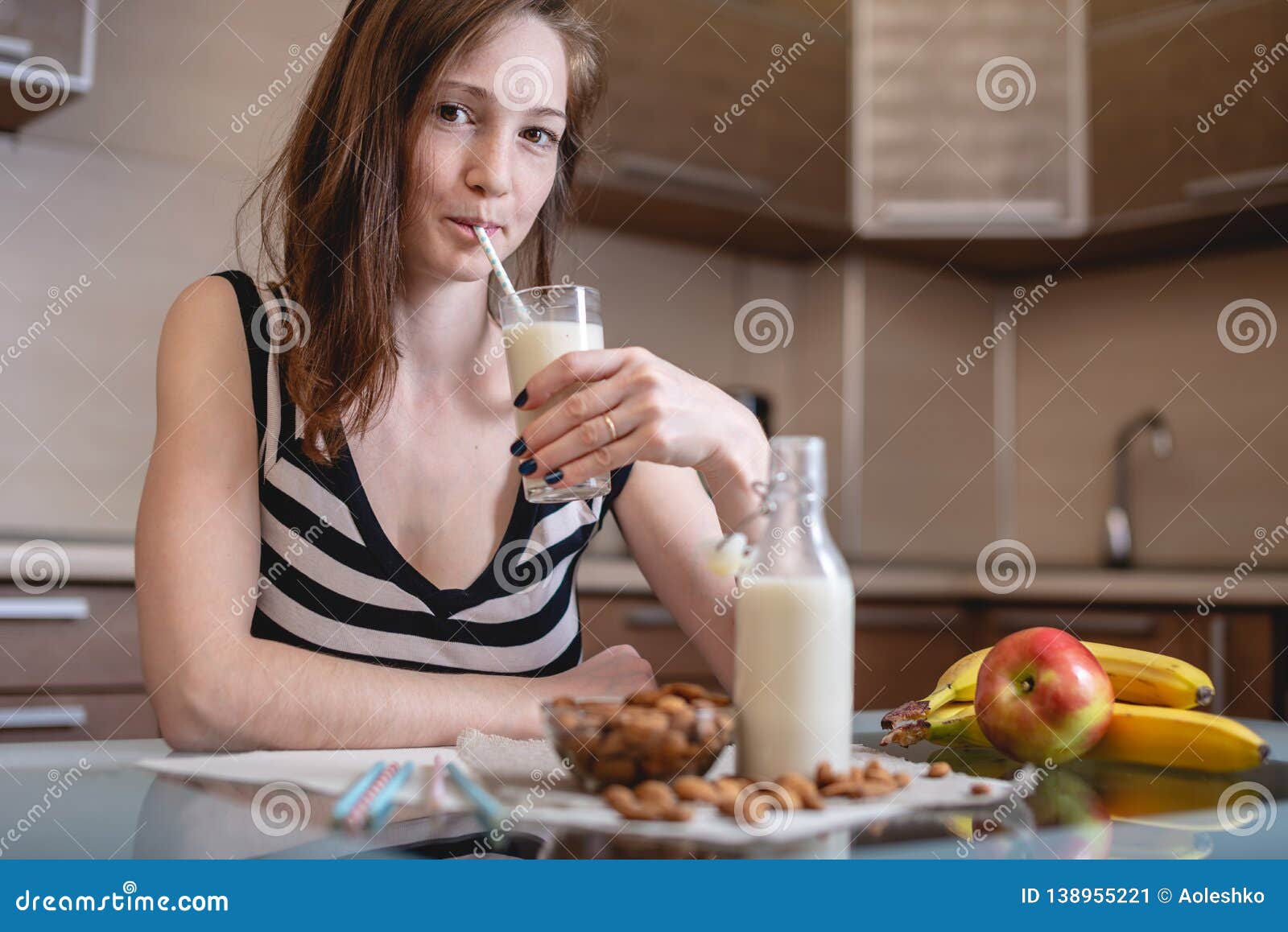 Woman Drinking Organic Almond Milk Holding A Glass In Her Hand I