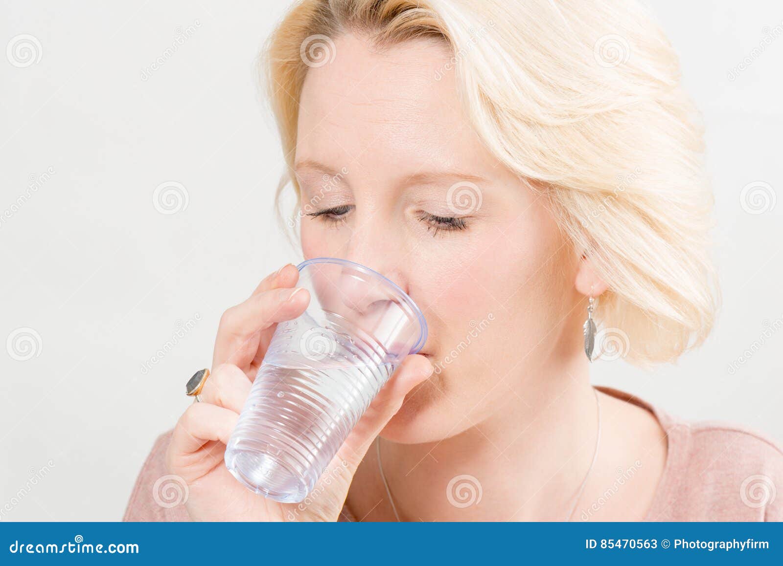 Woman Drinking Water from a Plastic Cup Stock Image Image of isolated