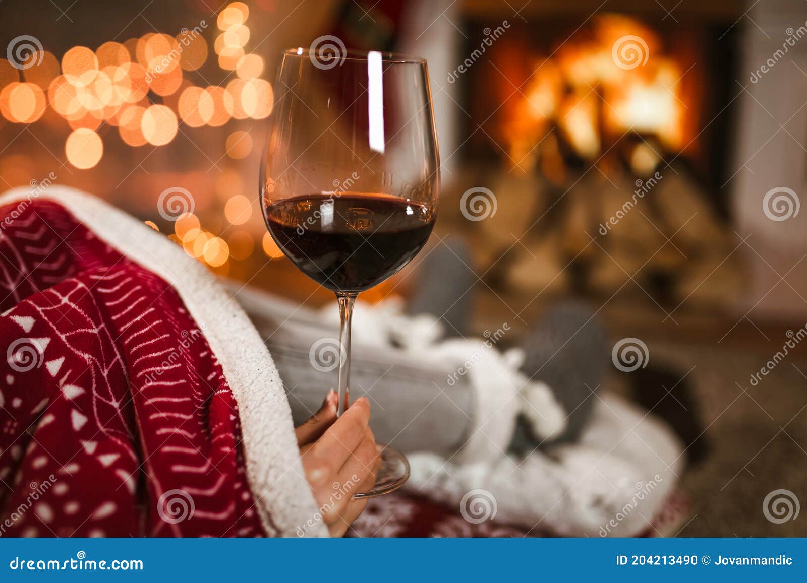Woman Drinking Wine from Glass Sitting and Relaxation Near Fireplace ...