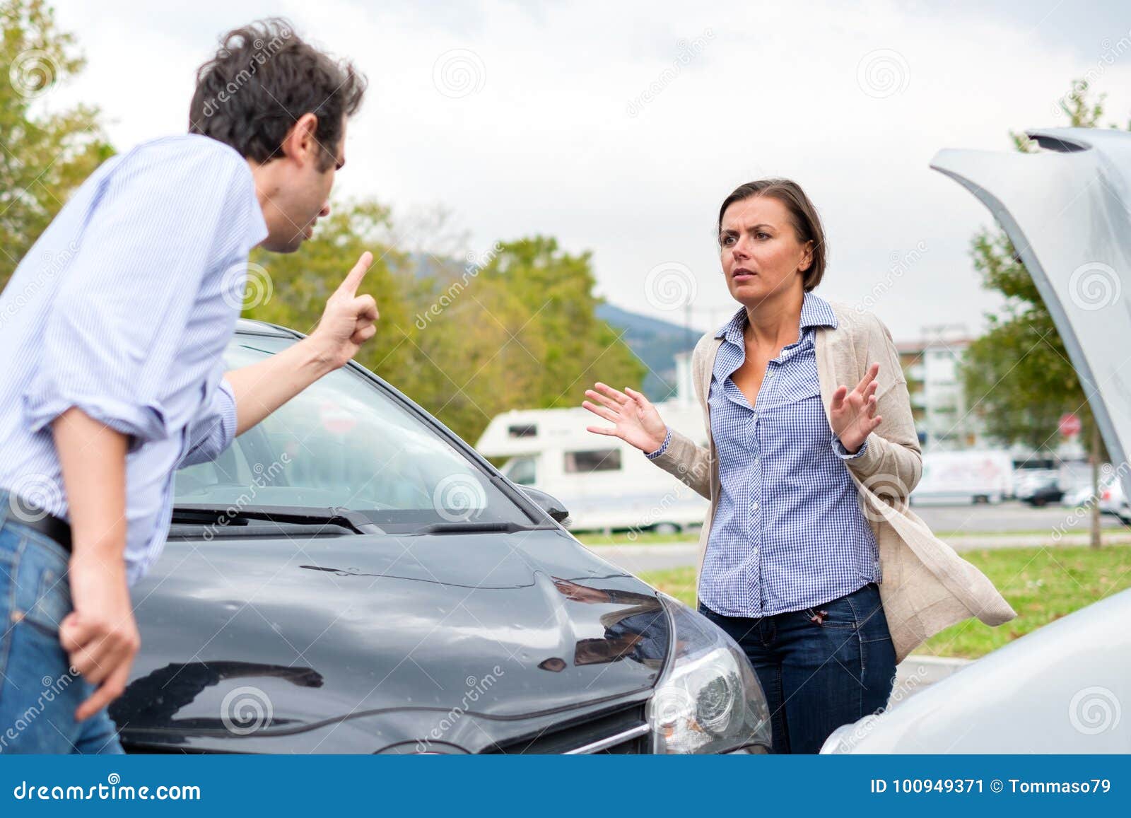 Woman Driver And Man Arguing About The Damage Of The Car After A Stock