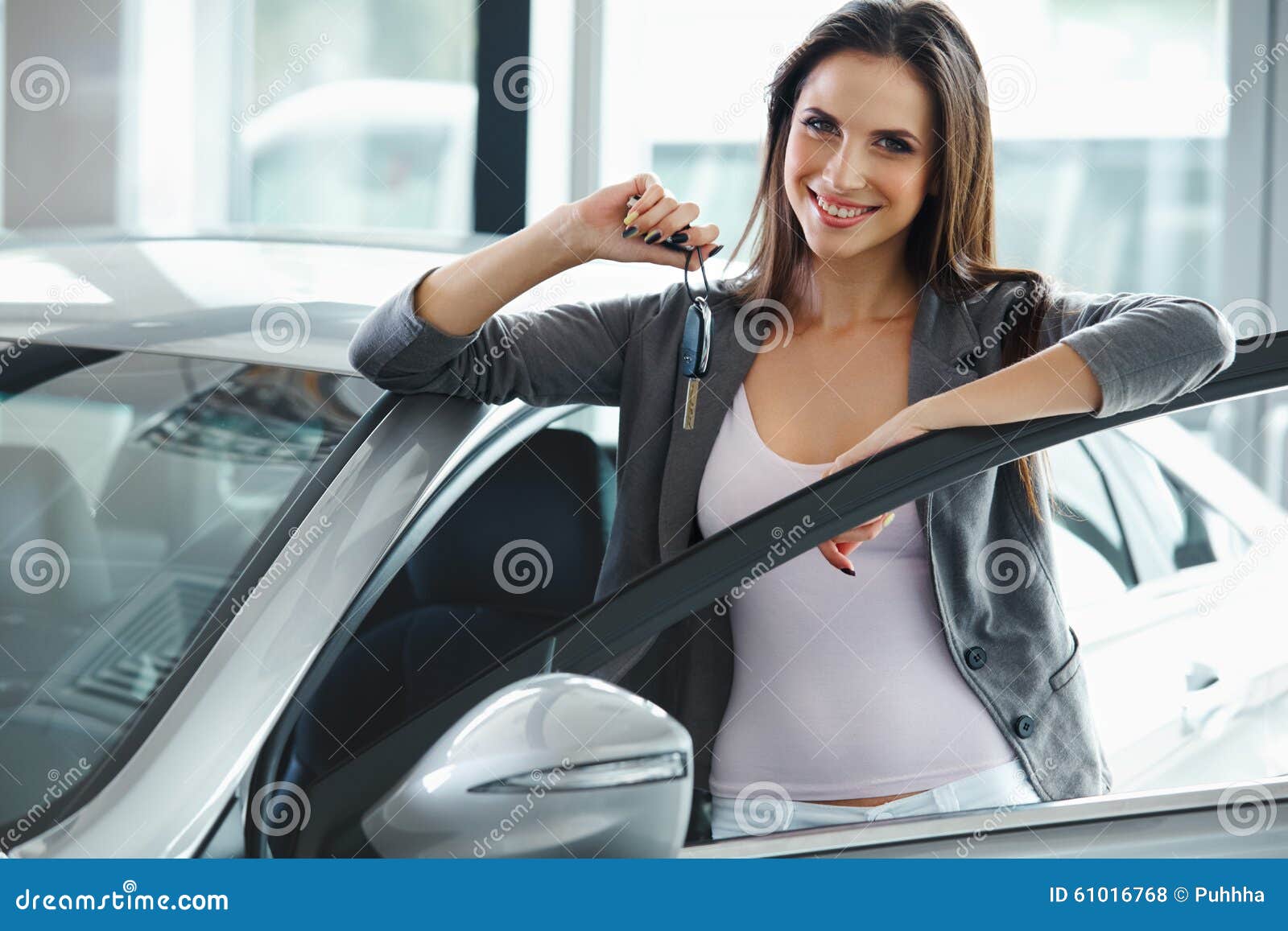 Woman Driver Holding Car Keys. Car Showroom. Stock Photo - Image of ...