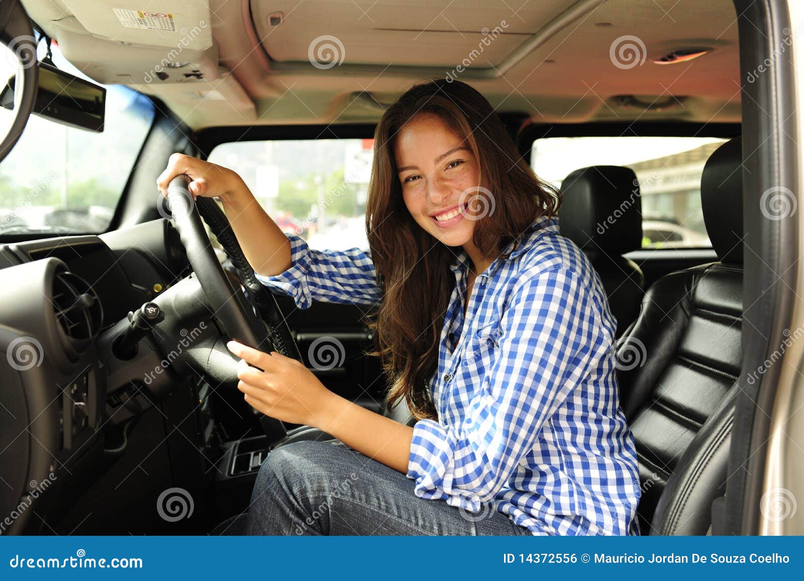 woman driving her new bulletproof truck