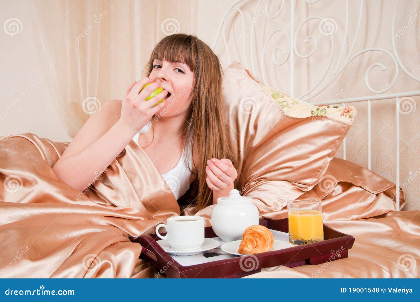 Woman eating breakfast stock photo. Image of background - 19001548