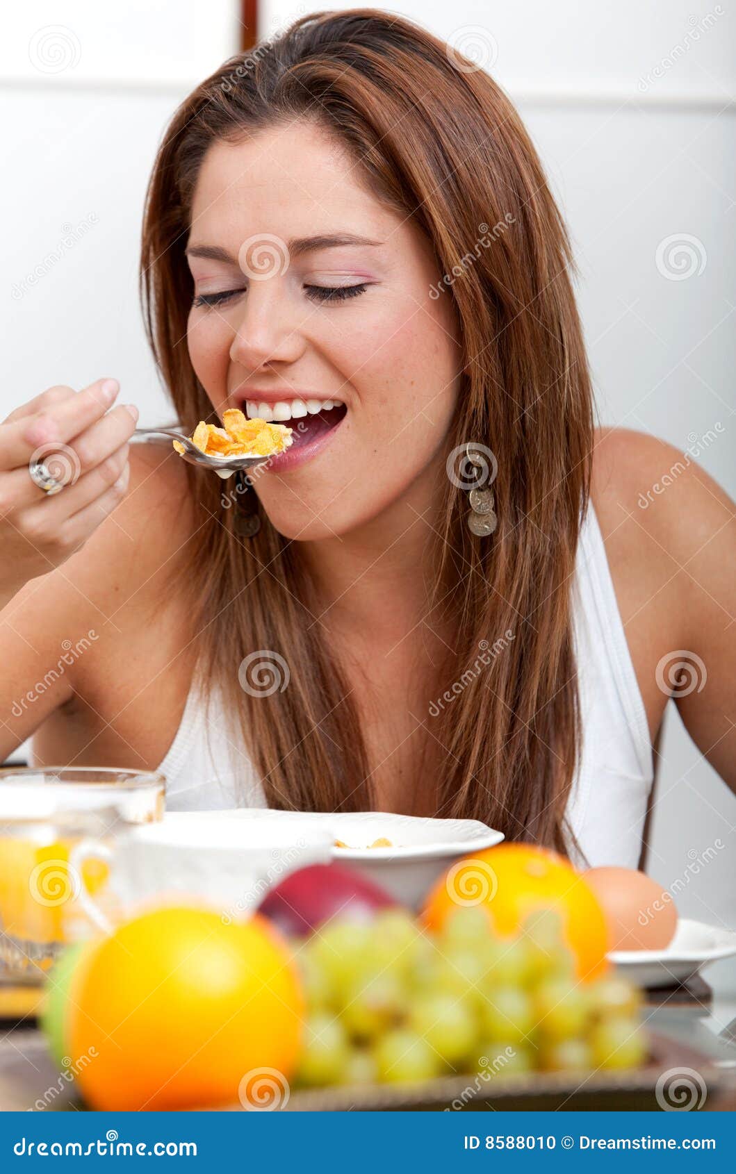 Woman eating breakfast stock photo. Image of nutrition - 8588010
