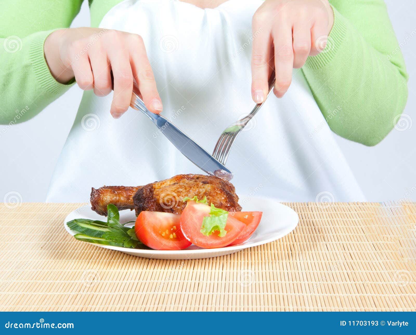 Woman eating chicken stock image. Image of fork, dinner 11703193