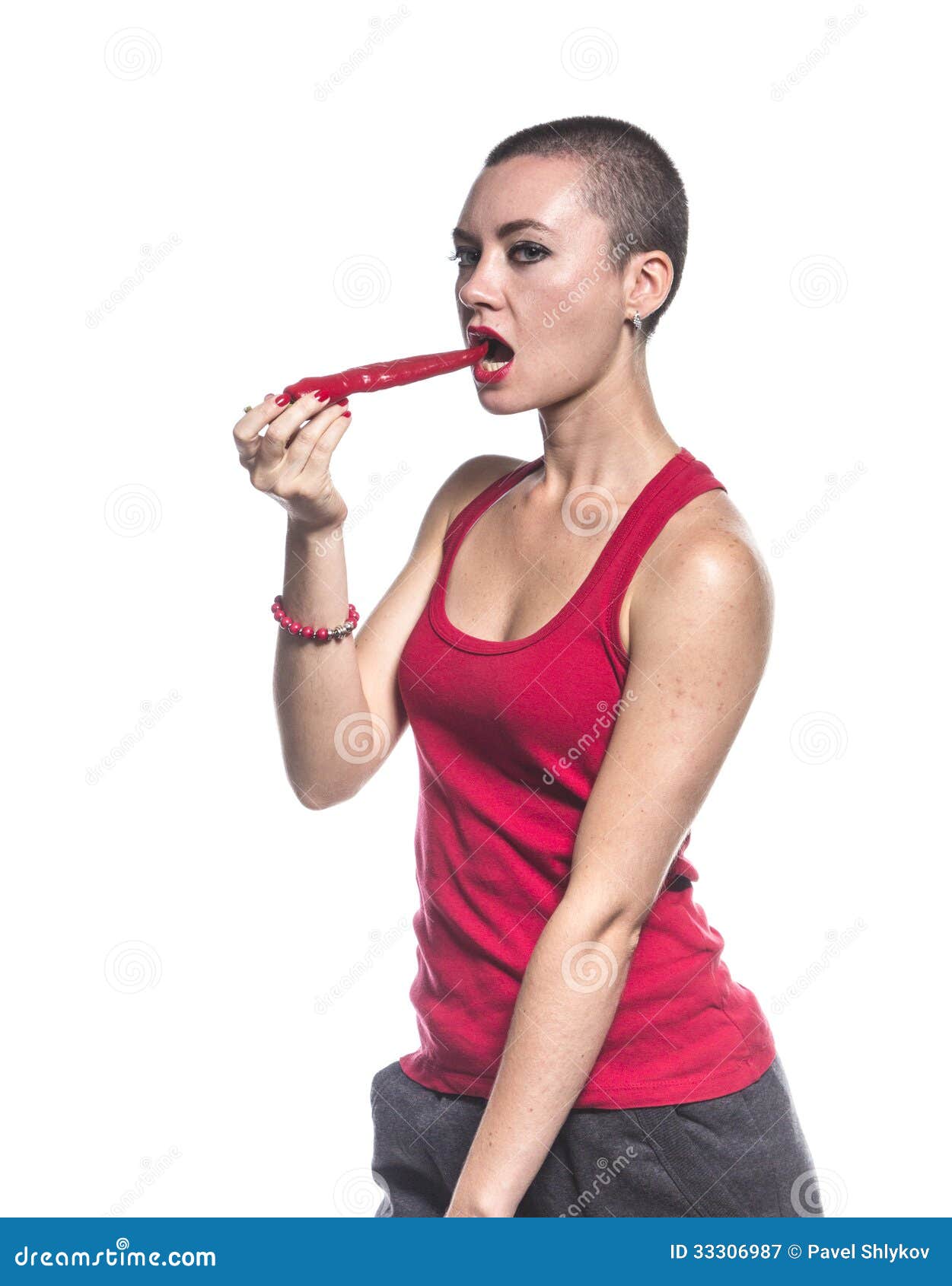 Woman eating chili pepper stock image. Image of vegetable 33306987