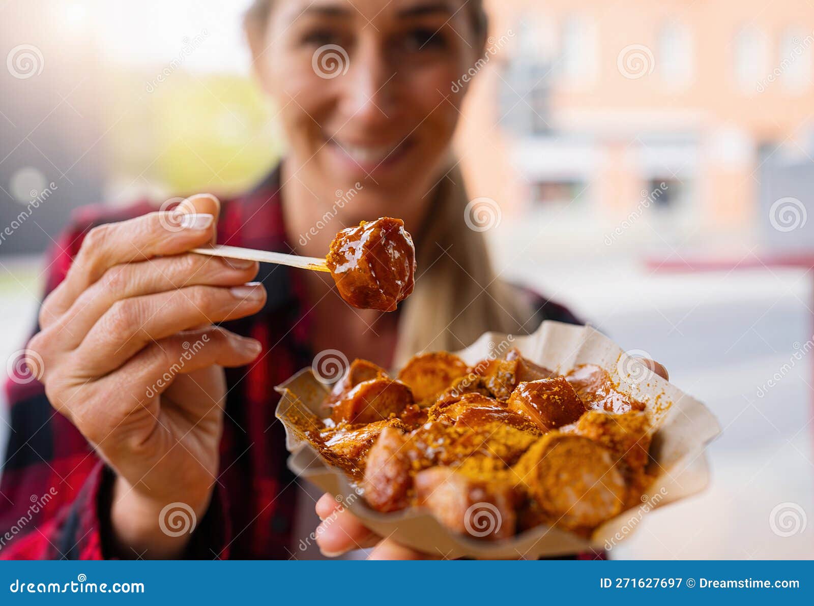 Woman Eating Currywurst Fast Food German Sausage in Outdoor Street Food