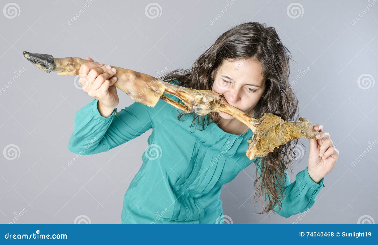 Woman Eating a Finished Ham Leg, Making Funny Face Stock Photo Image