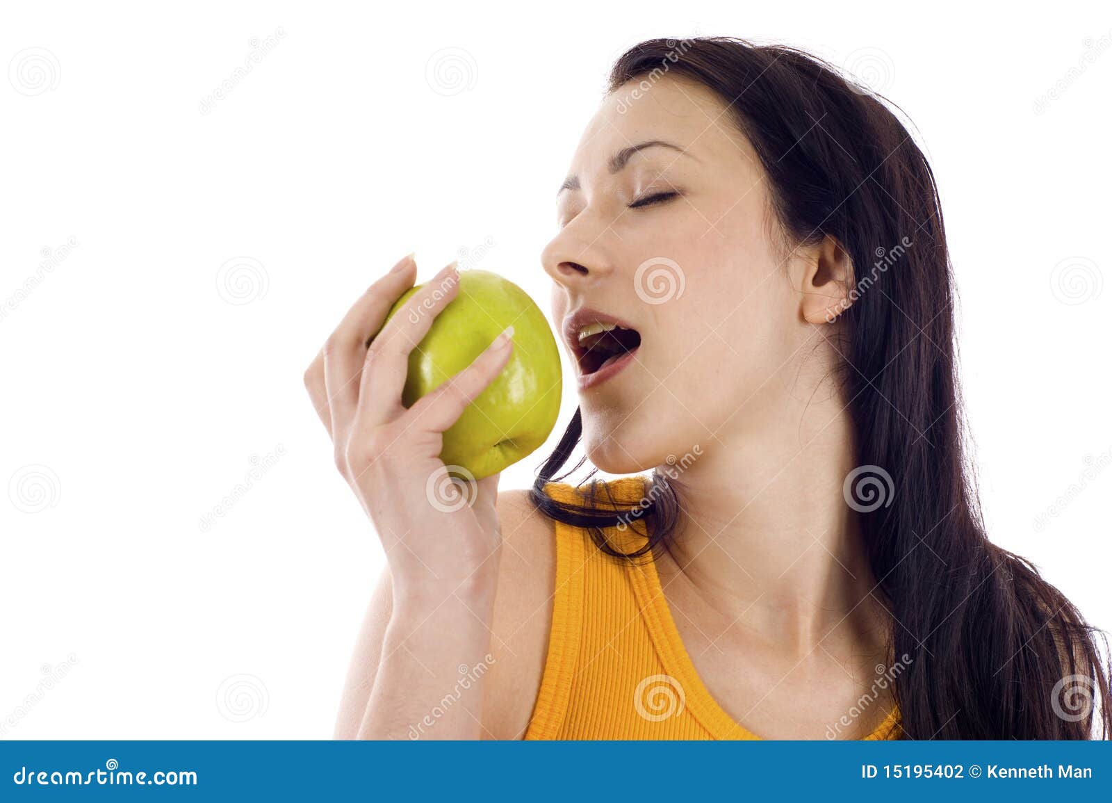 Woman eating a green apple stock photo. Image of happy 15195402