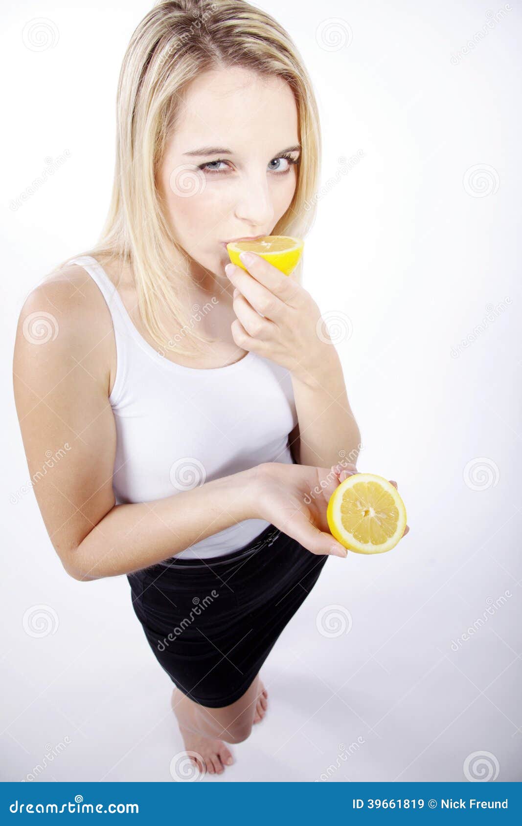 Woman eating a lemon stock image. Image of colorful, eyes 39661819