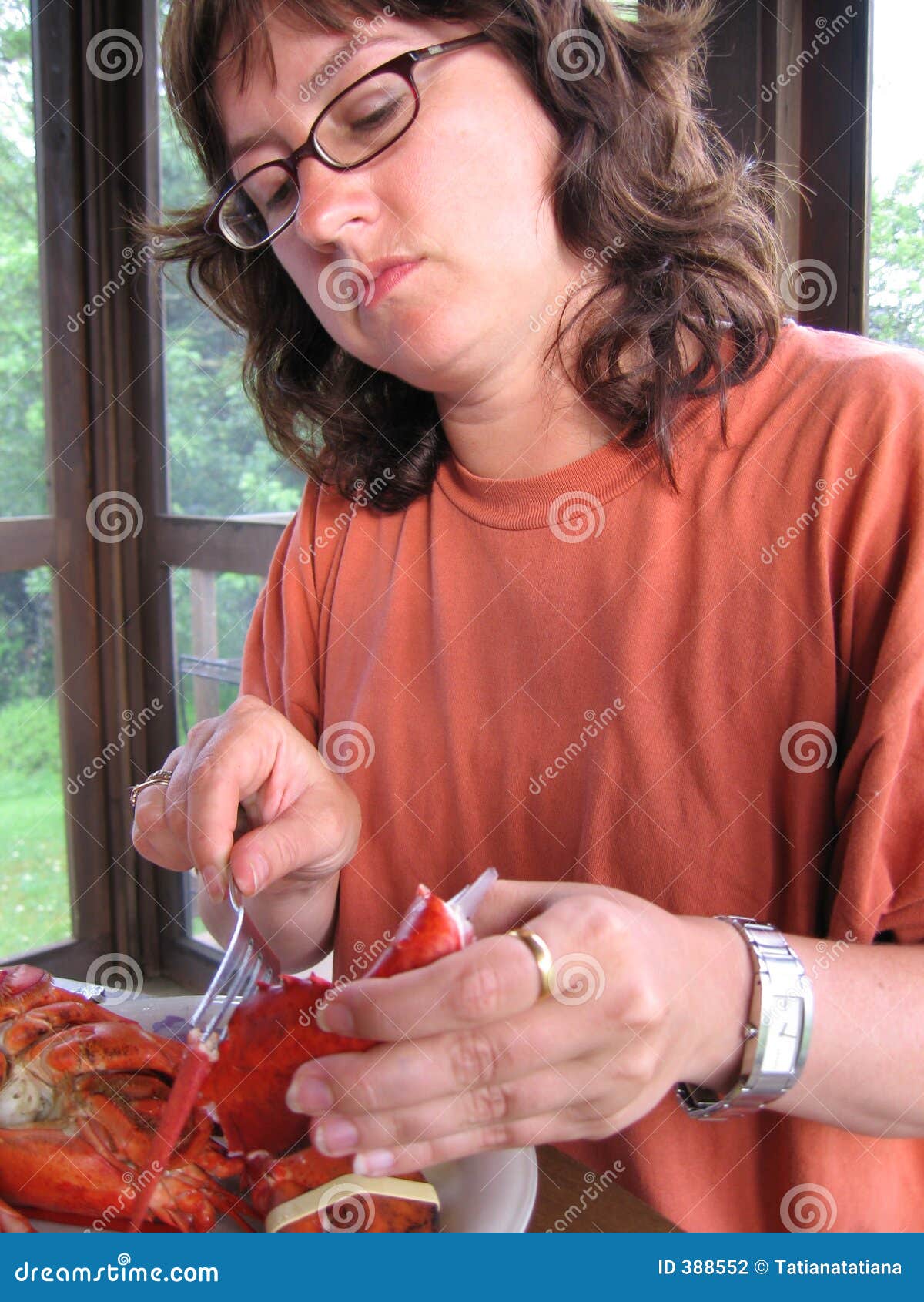 Woman Eating Lobster stock photo. Image of eating, activity 388552