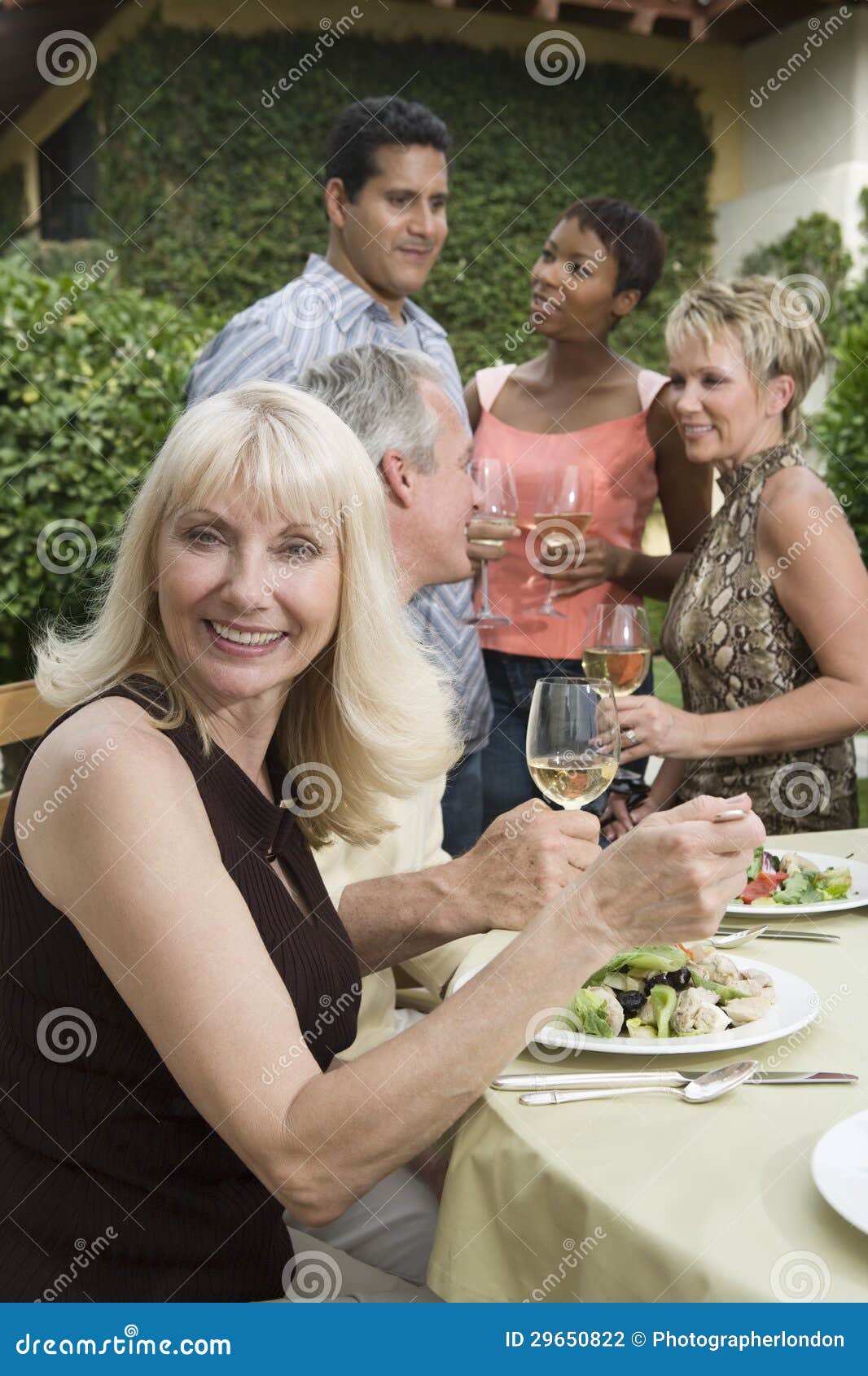 Woman Eating Lunch with Friends Stock Photo Image of glass