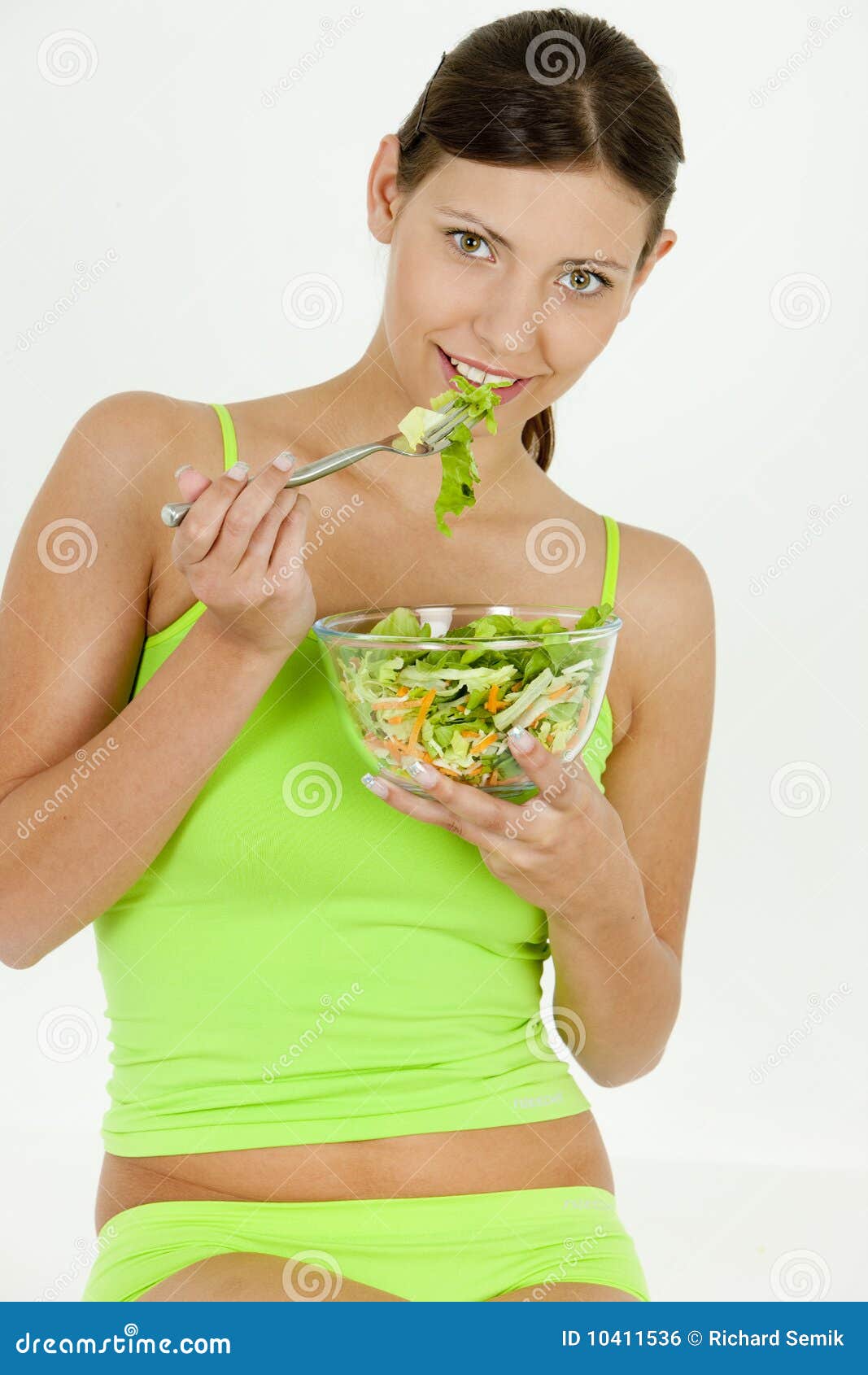 women laughing alone with salad