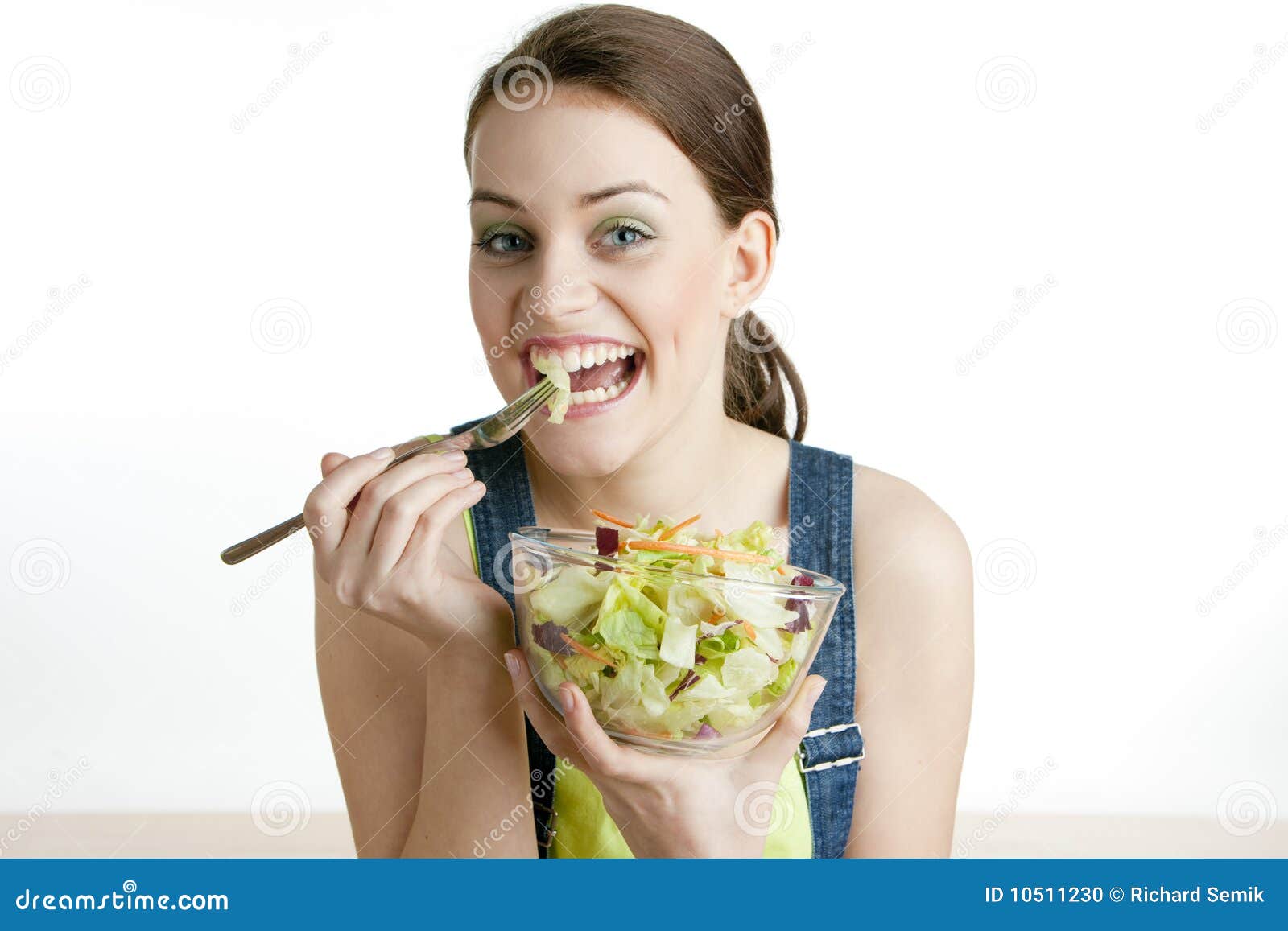 Woman eating salad stock photo. Image of eating, emotions 10511230